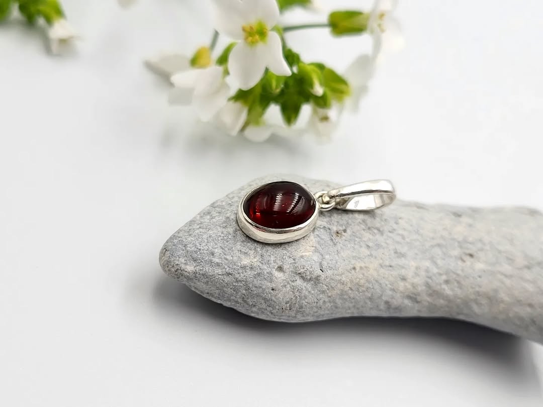 Deep red Baltic amber pendant necklace in silver