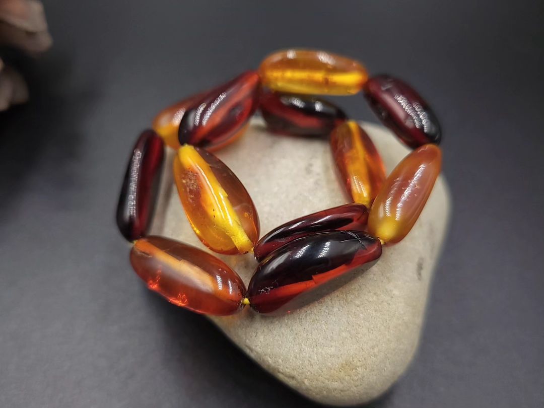 Tetibel Amber Bracelet. Polished Cognac & Cherry Olive Beads