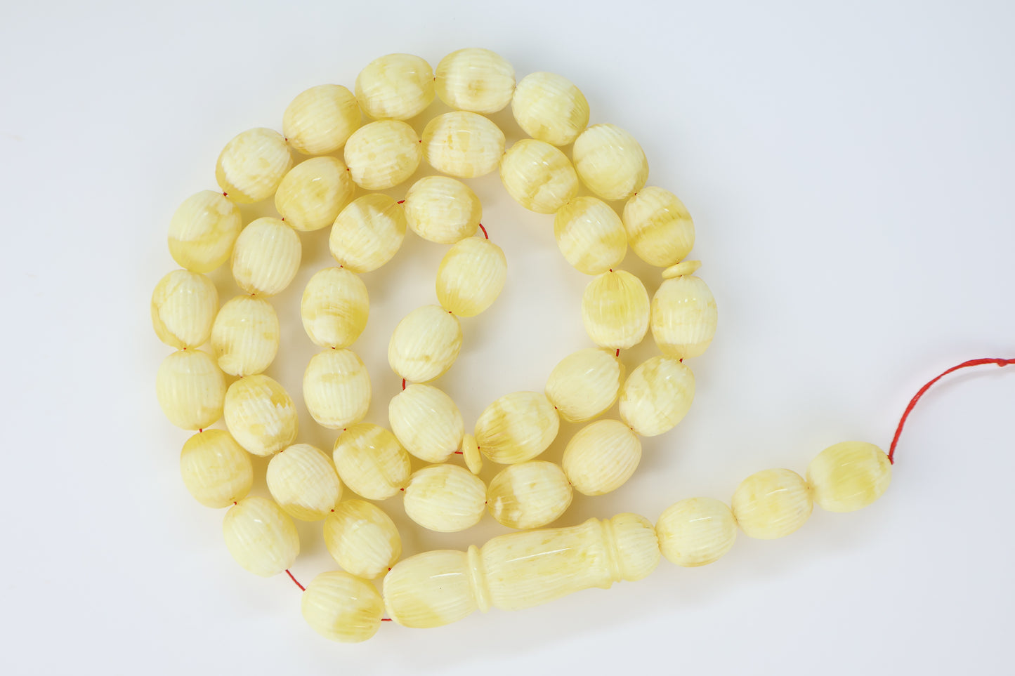 Pressed Baltic amber carved textured prayer beads 42 beads 15x12mm 56.12g with lab certificate from Tetibel Amber Jewels