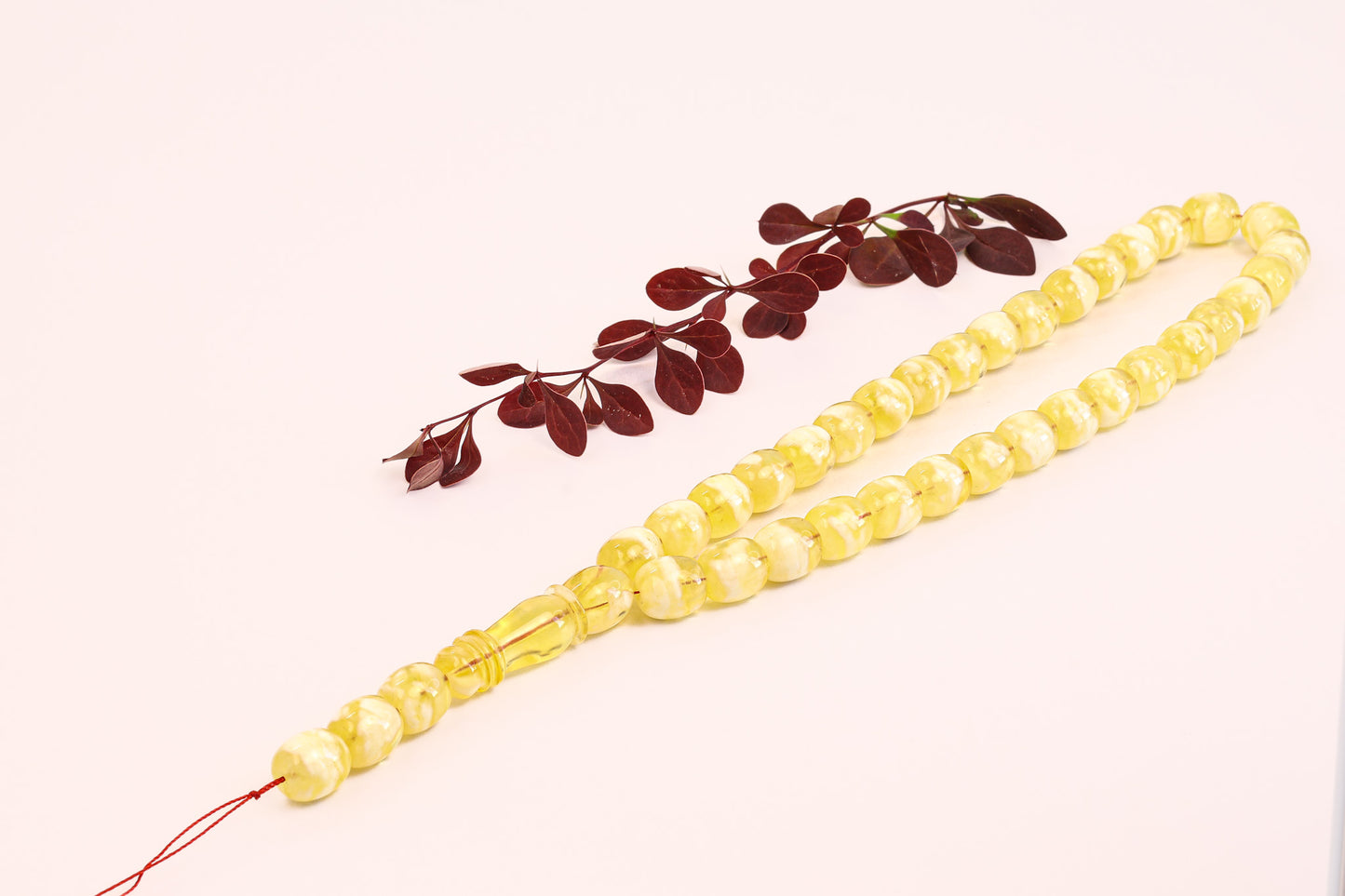 Full view of the Tetibel Jewels 36-bead amber prayer beads (Gebetskette) with milky yellow opaque finish.