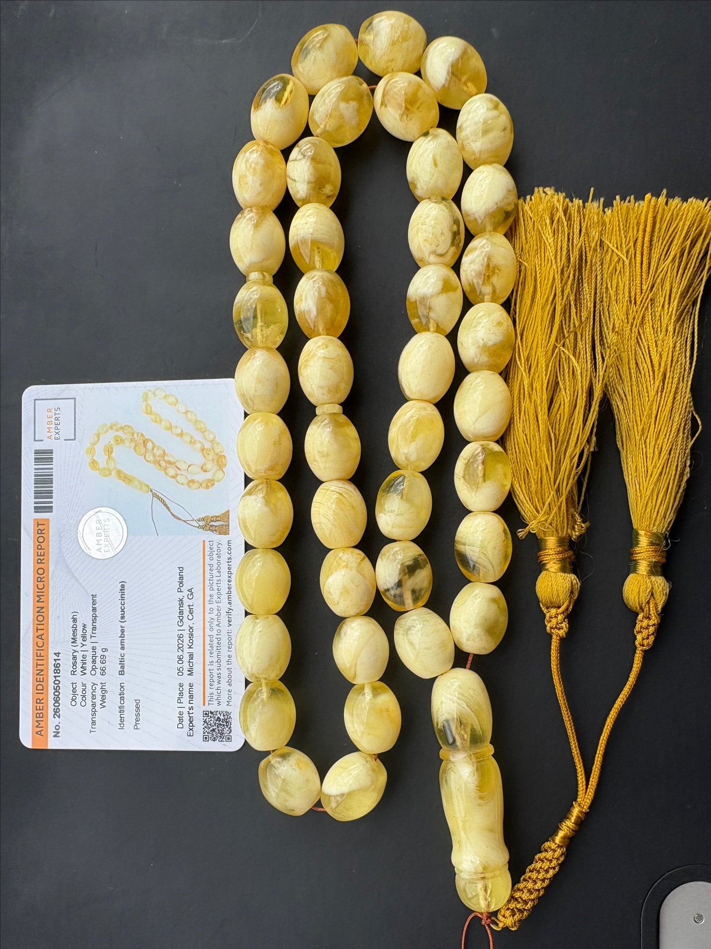 Tetibel Baltic Amber Mesbah rosary with 42 certified pressed white and yellow oval beads measuring 15x12mm, 66.69g, featuring a luxury handmade tassel from Doha, Qatar and Amber Experts certificate.
