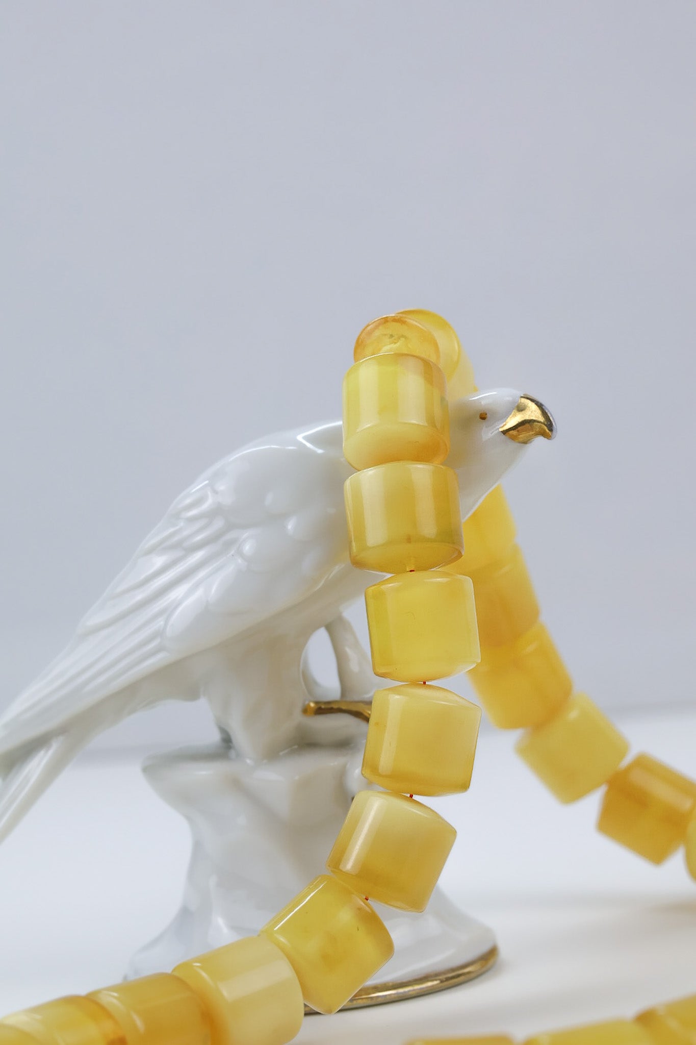 Pressed Baltic amber rosary in butterscotch yellow with polished barrel beads and red thread, handmade luxury prayer beads