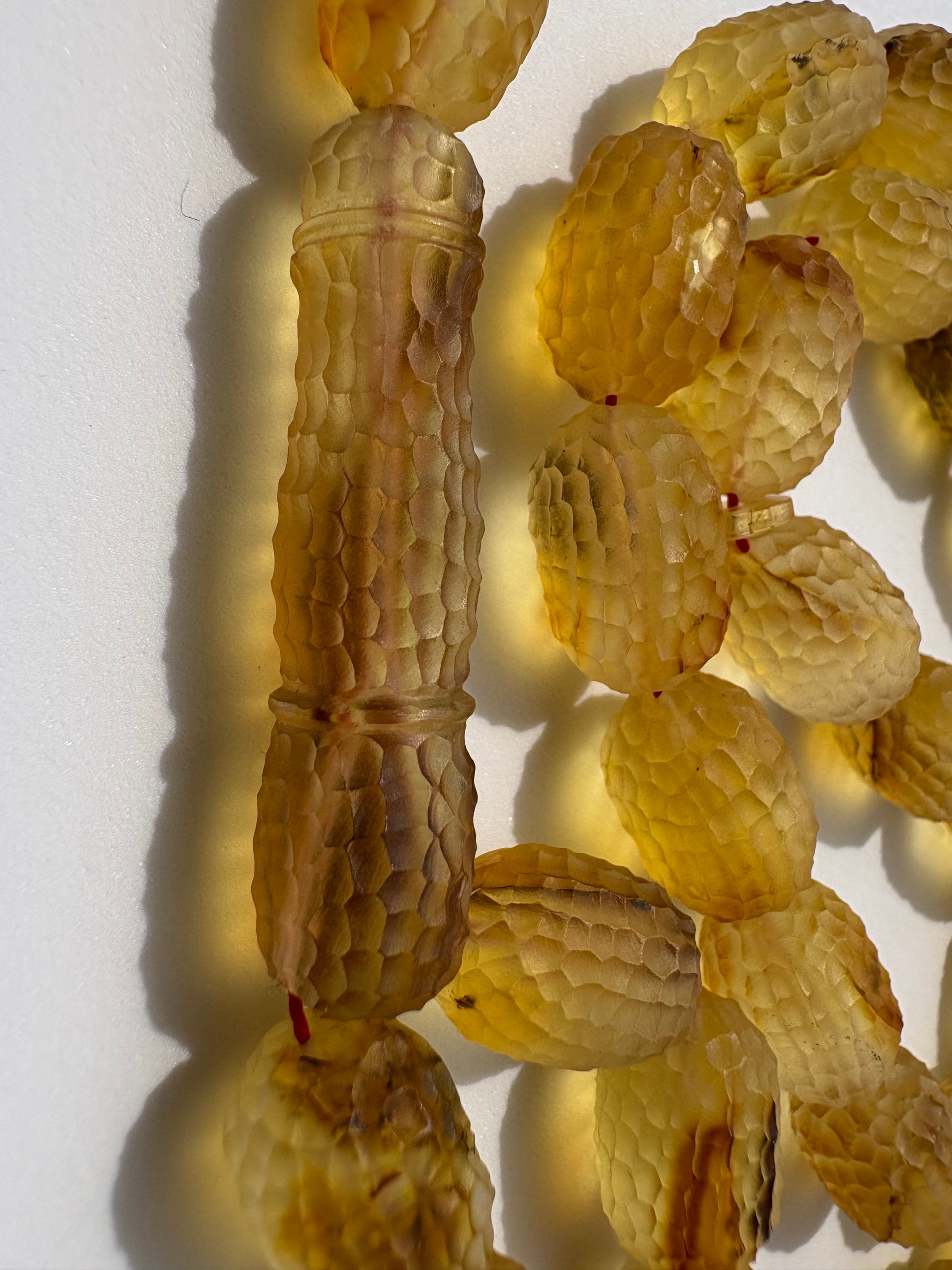 Certified Baltic amber Tesbih with 41 carved barrel-shaped honey amber beads.