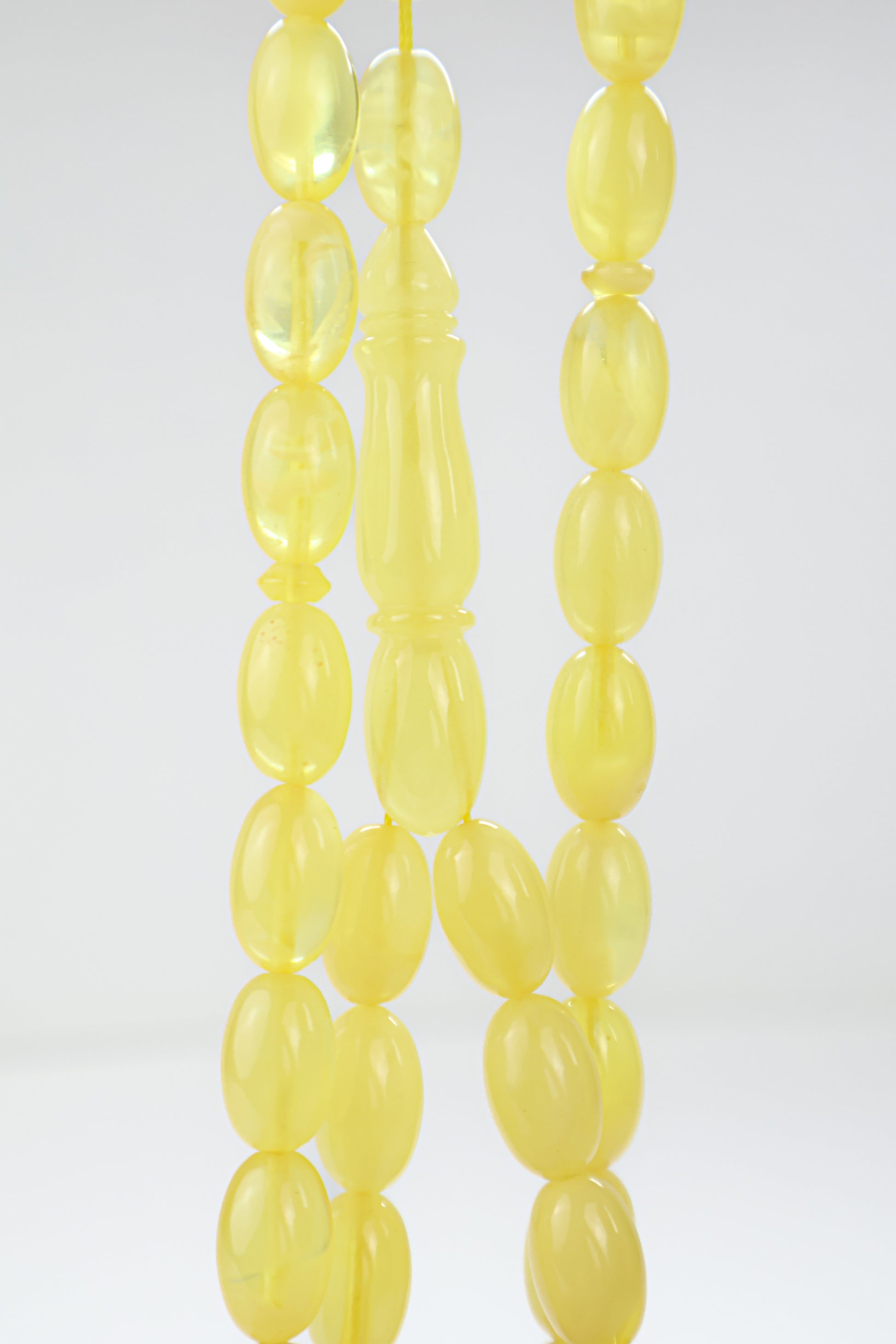 Certified natural translucent yellow Baltic amber misbaha rosary with 42 beads measuring 14.5x9 mm by Tetibel.