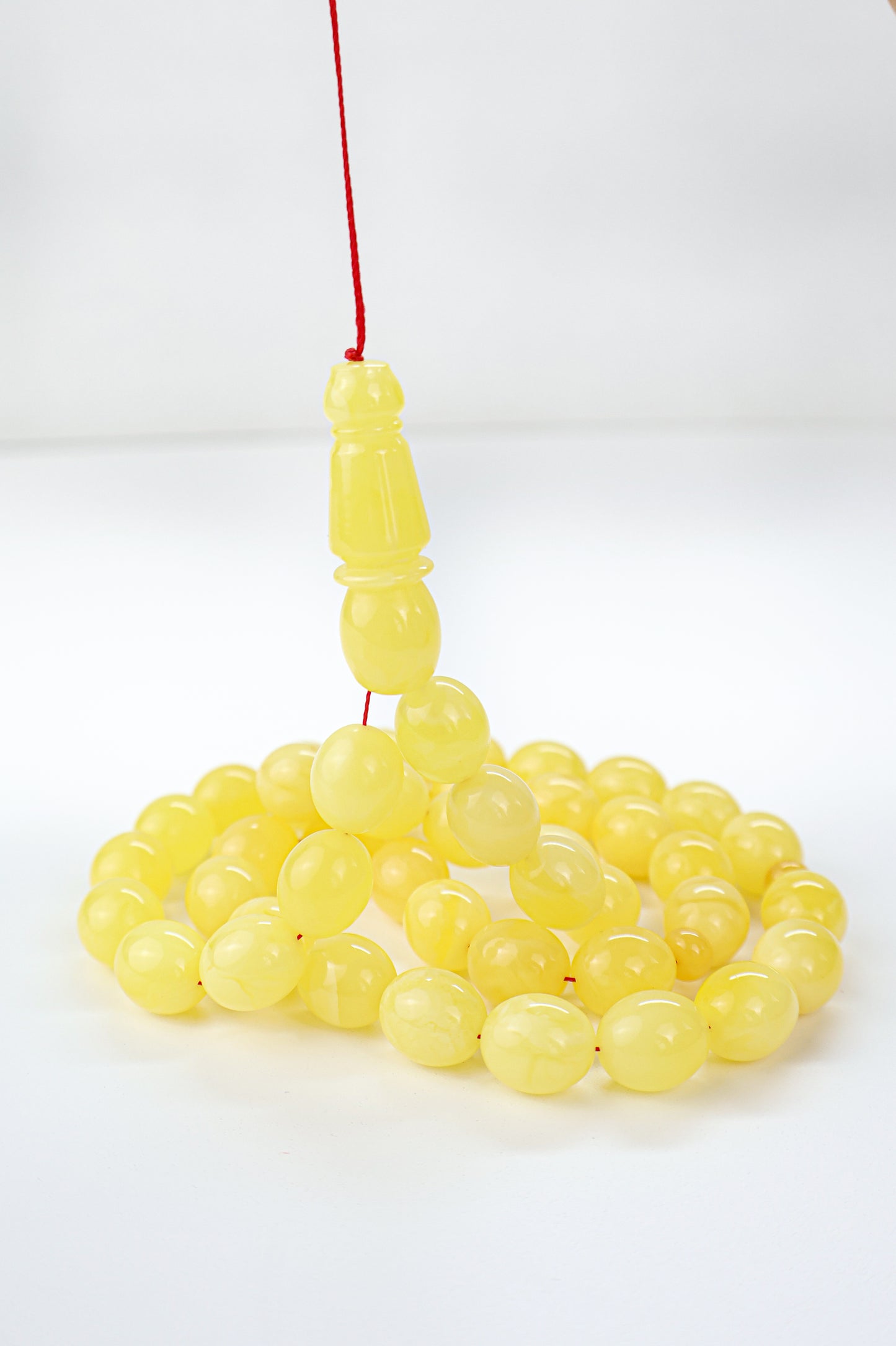 Handcrafted opaque yellow succinite amber tasbih featuring 45 authentic beads, weight 52.45 grams.