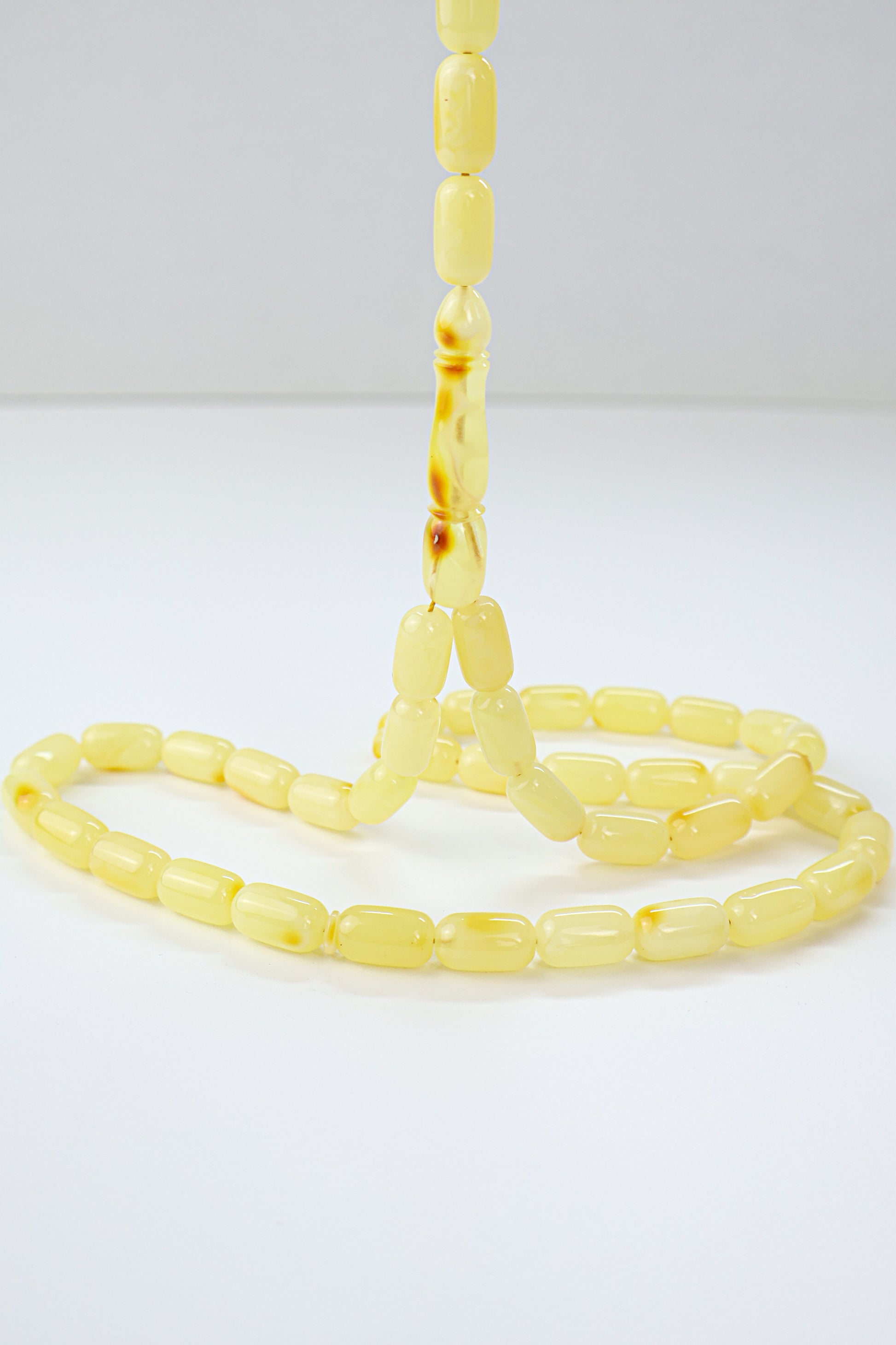 Natural Baltic amber Tesbih featuring 42 polished yellow amber beads.