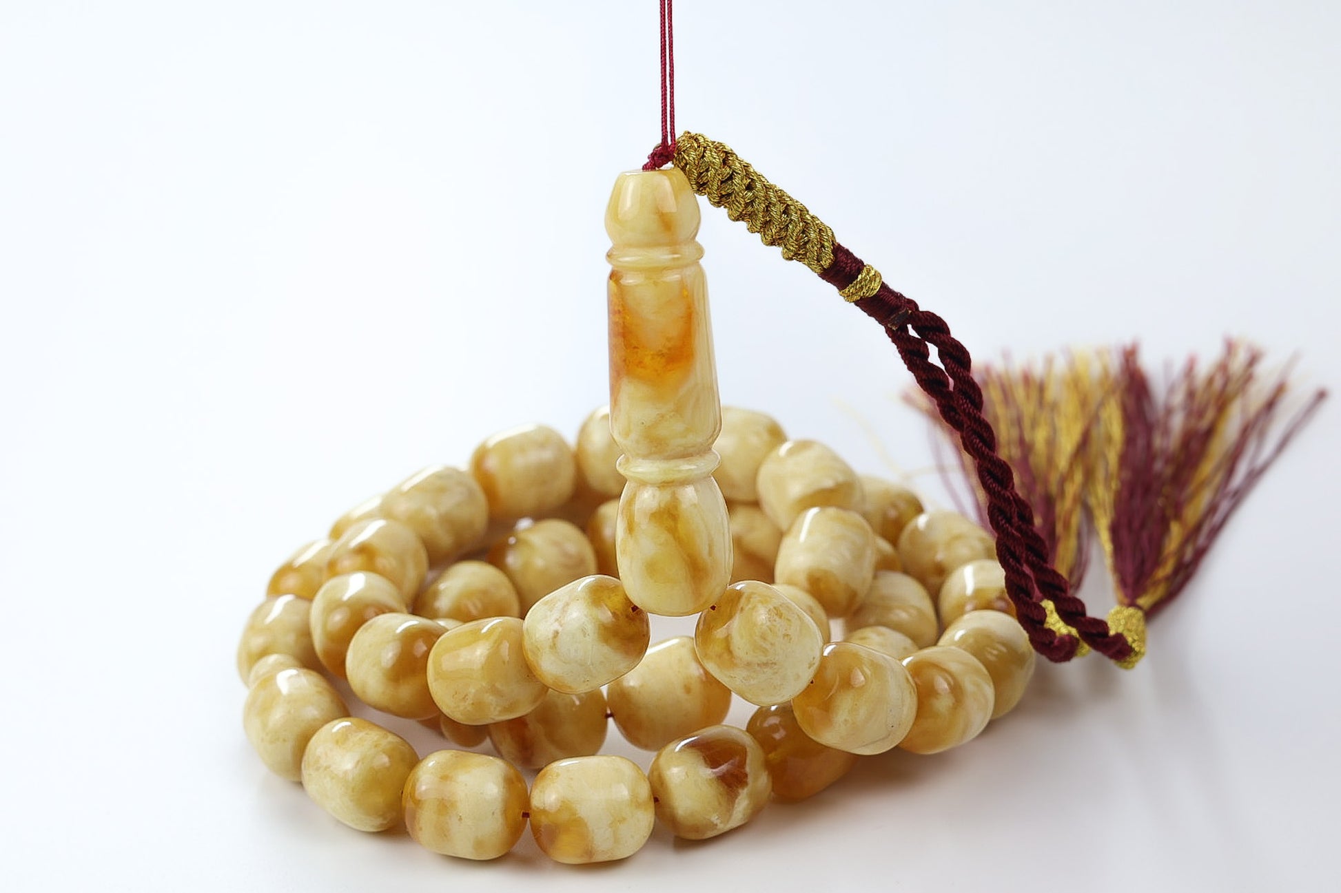 Handmade butterscotch Baltic amber tasbih with 42 round beads and maroon tassel, luxury Islamic prayer beads for men