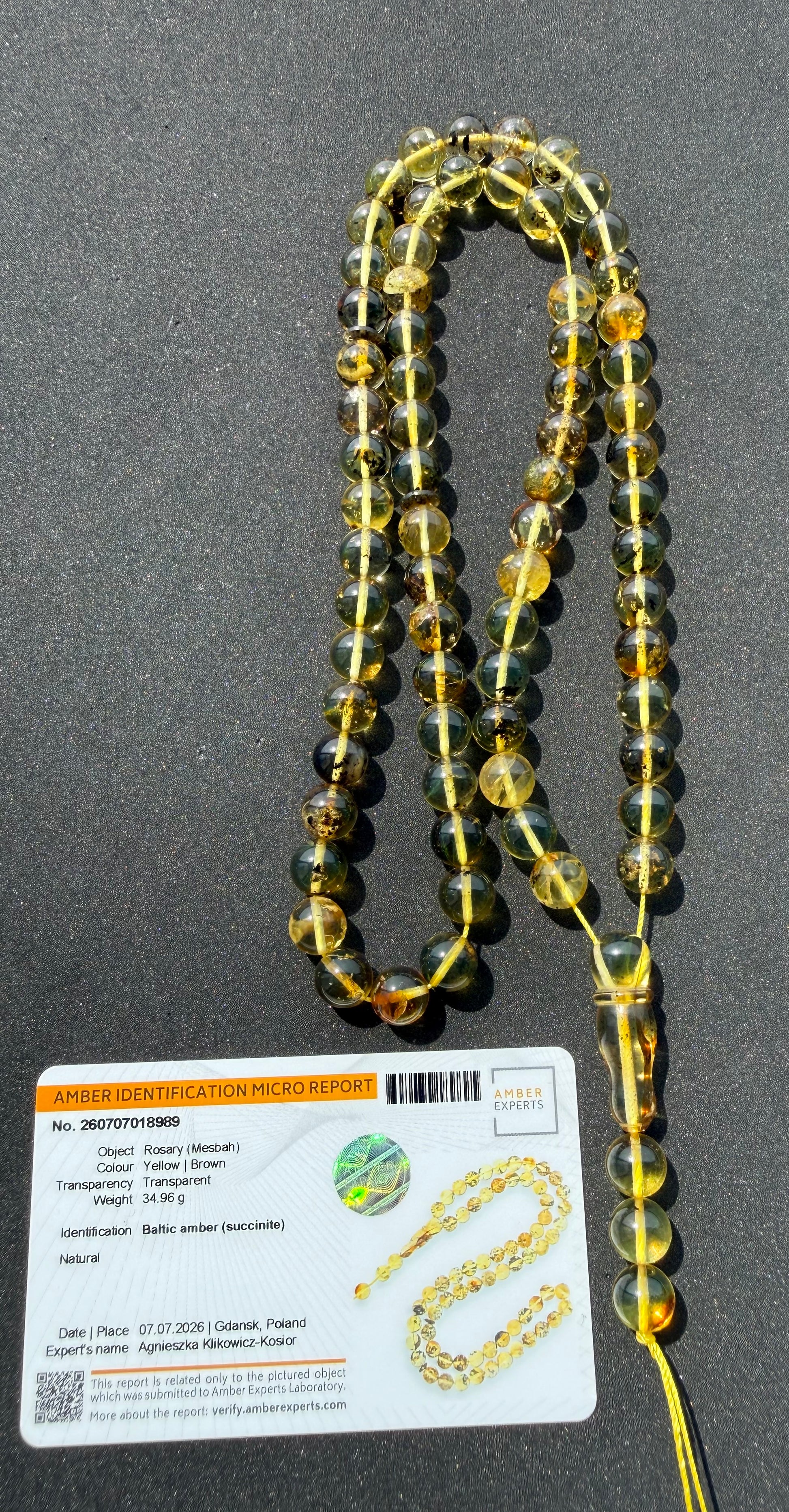 Certified Baltic amber Misbaha featuring golden honey and cognac succinite beads.