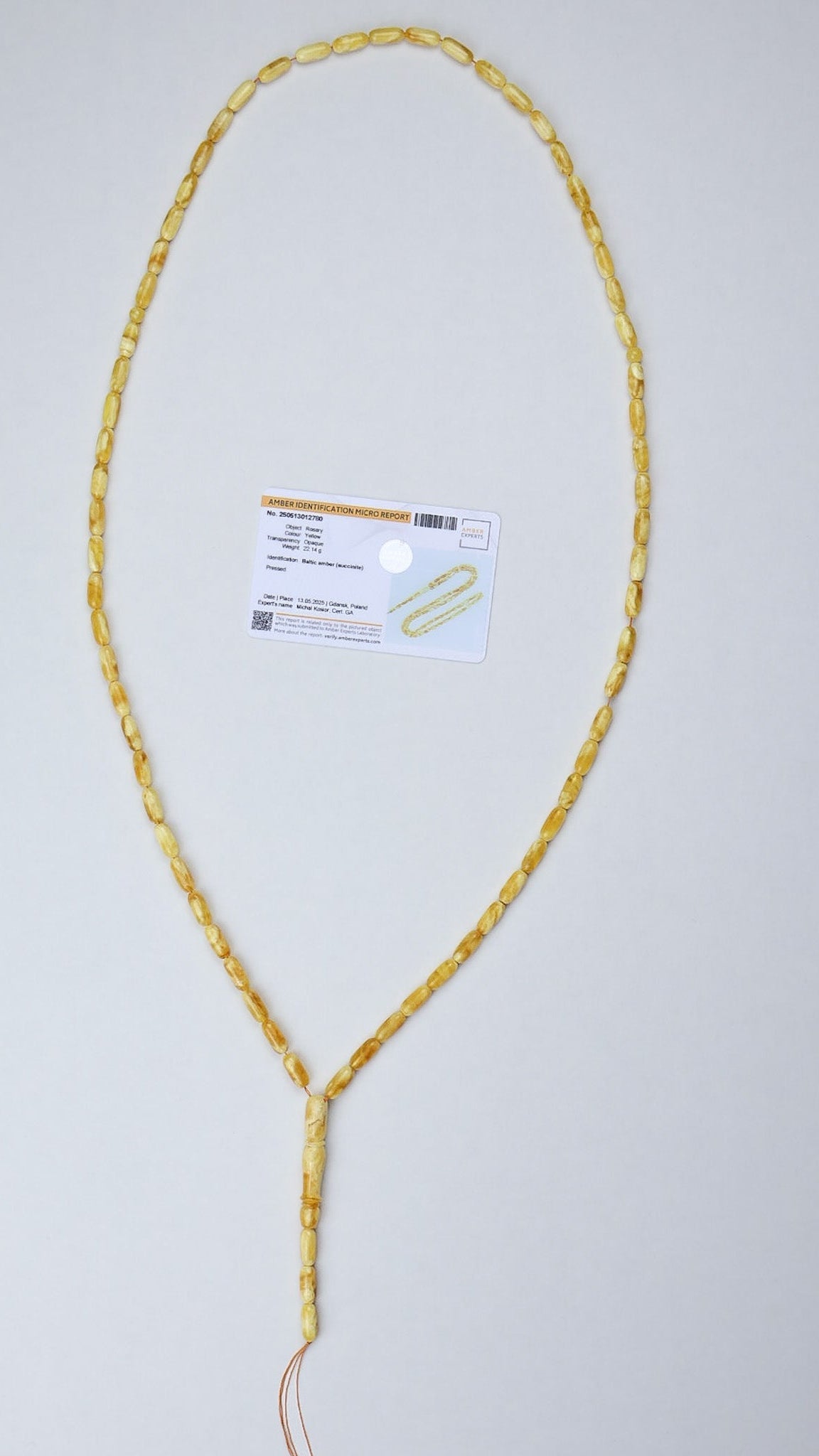 Certified Baltic amber misbaha 22g yellow succinite flat lay with authenticity certificate