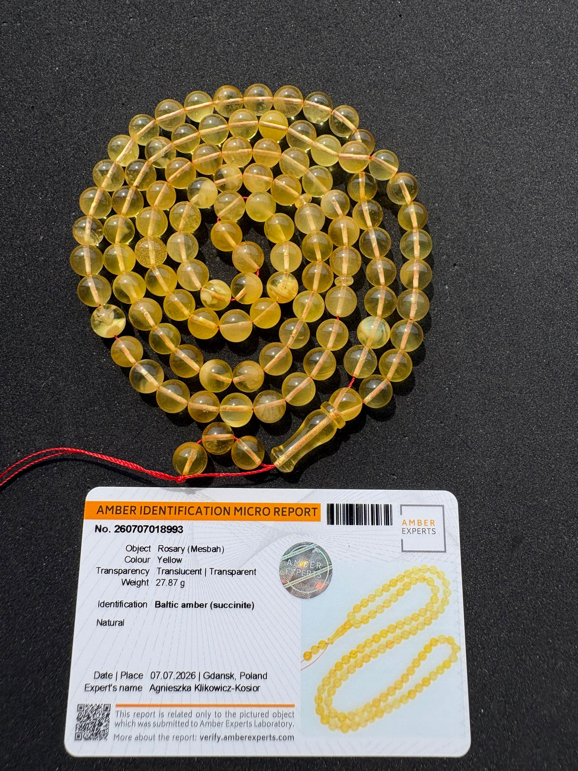 Genuine succinite amber prayer beads in transparent golden lemon color.