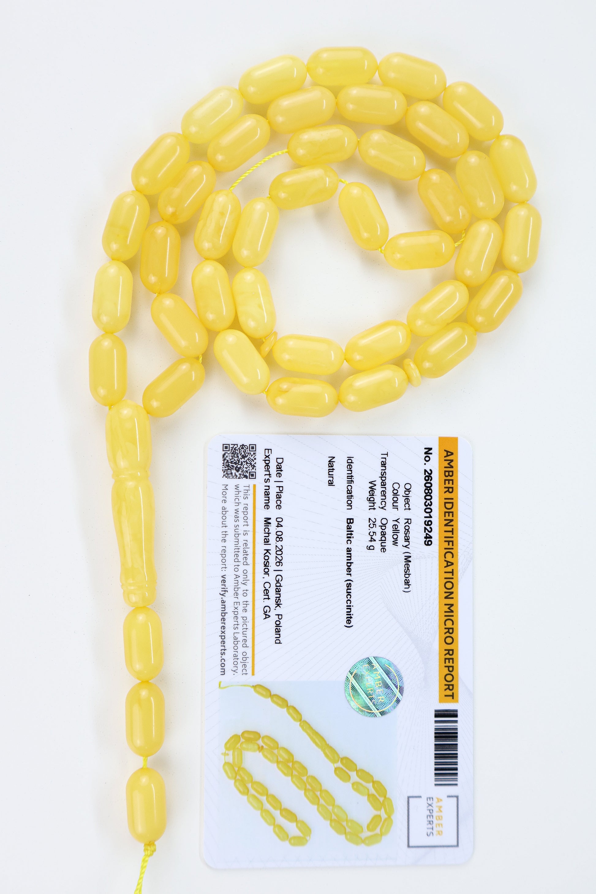 Certified Baltic amber rosary with 42 creamy lemon-yellow succinite beads measuring 14.4x7.5mm and weighing 25.54g.