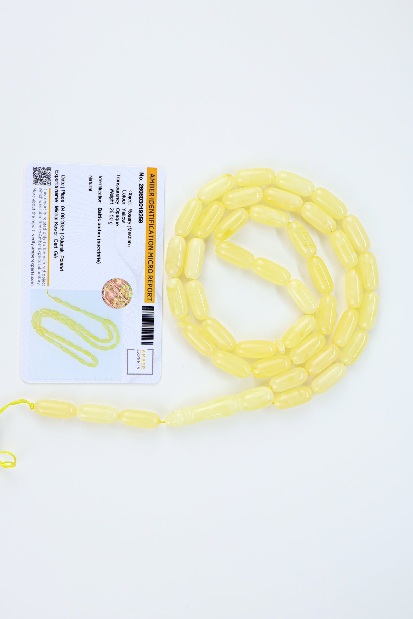 Certified Baltic amber rosary with 42 creamy lemon-yellow succinite beads measuring 16x7mm and weighing 26.5g.