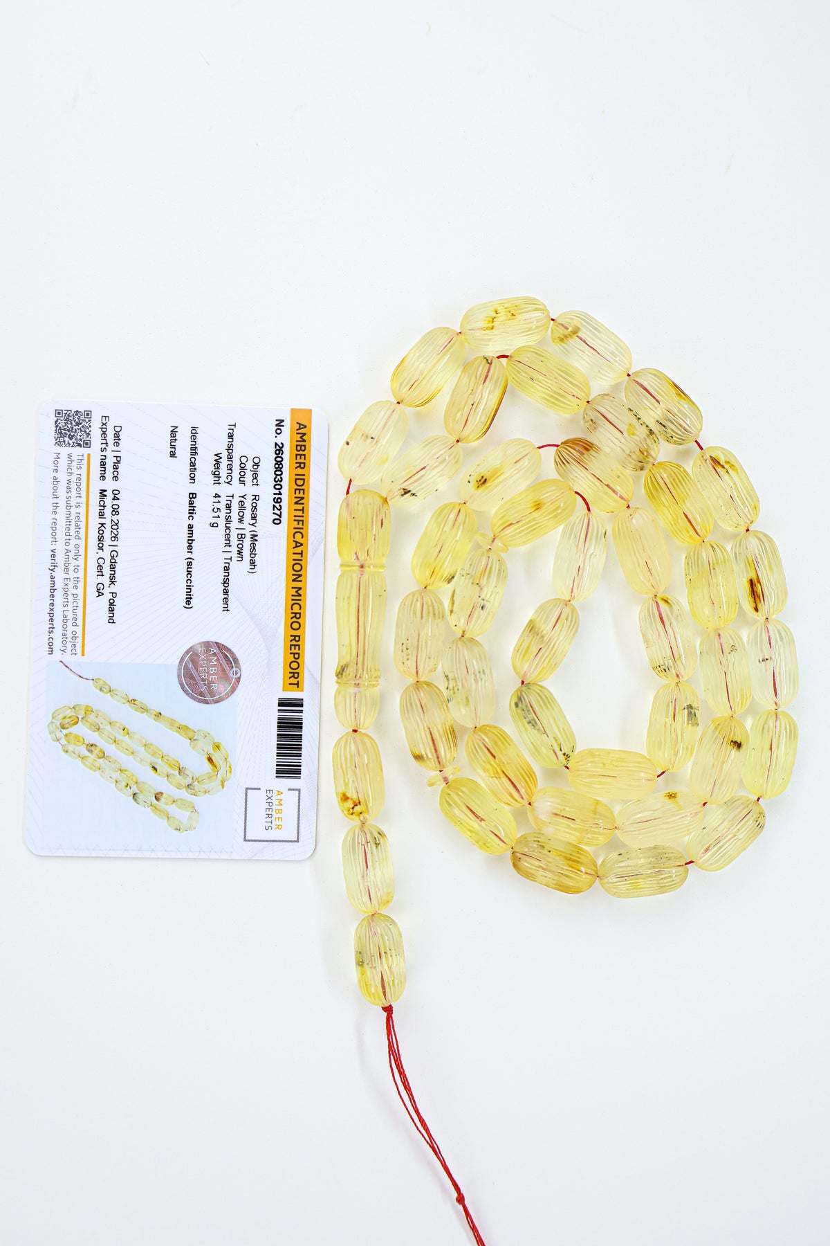 Certified natural hand-carved translucent yellow and brown Baltic amber misbaha rosary with 42 beads measuring 17x9 mm by Tetibel.