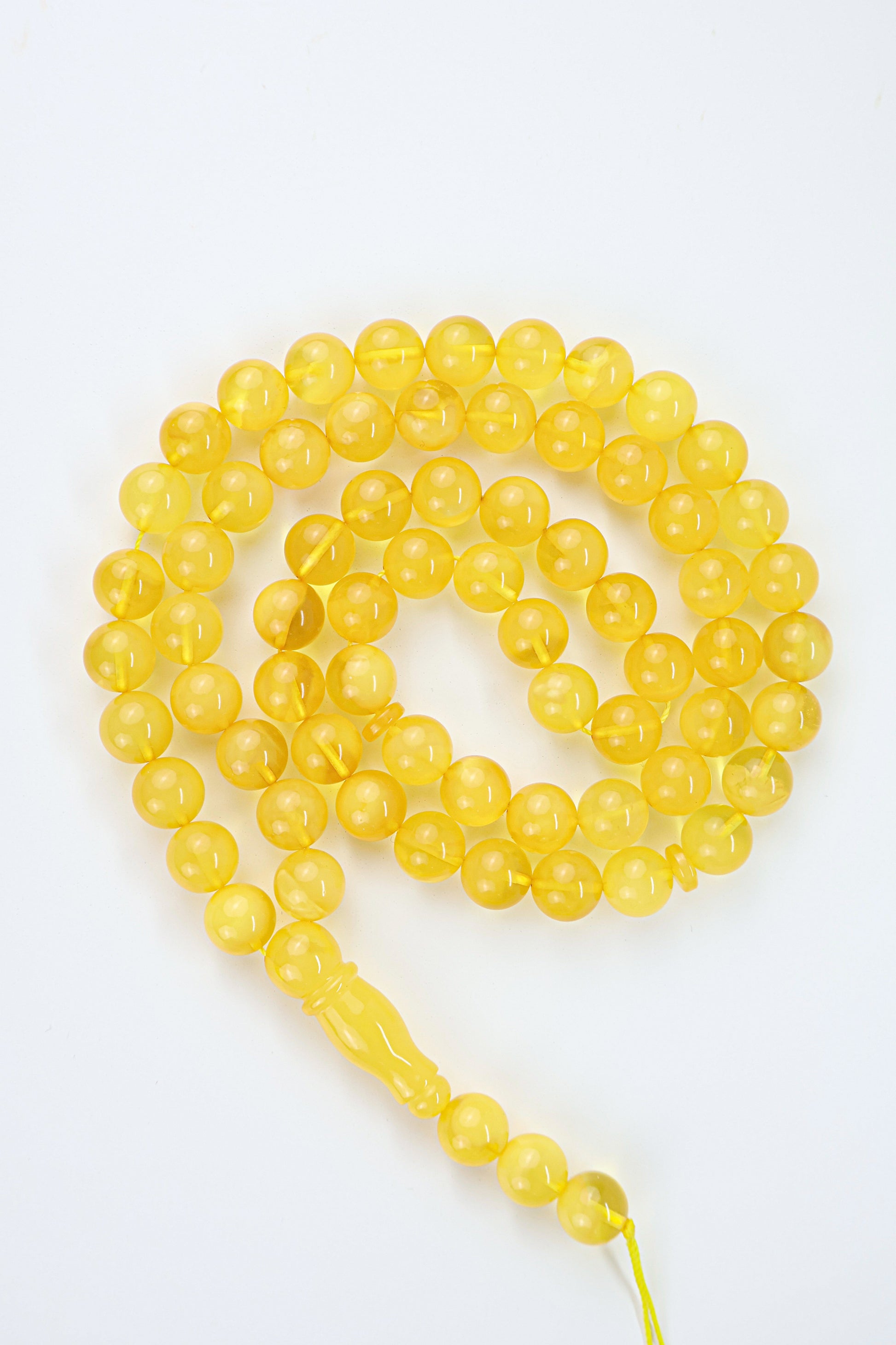 Certified natural dark yellow Baltic amber misbaha rosary with 69 round beads measuring 10mm by Tetibel.
