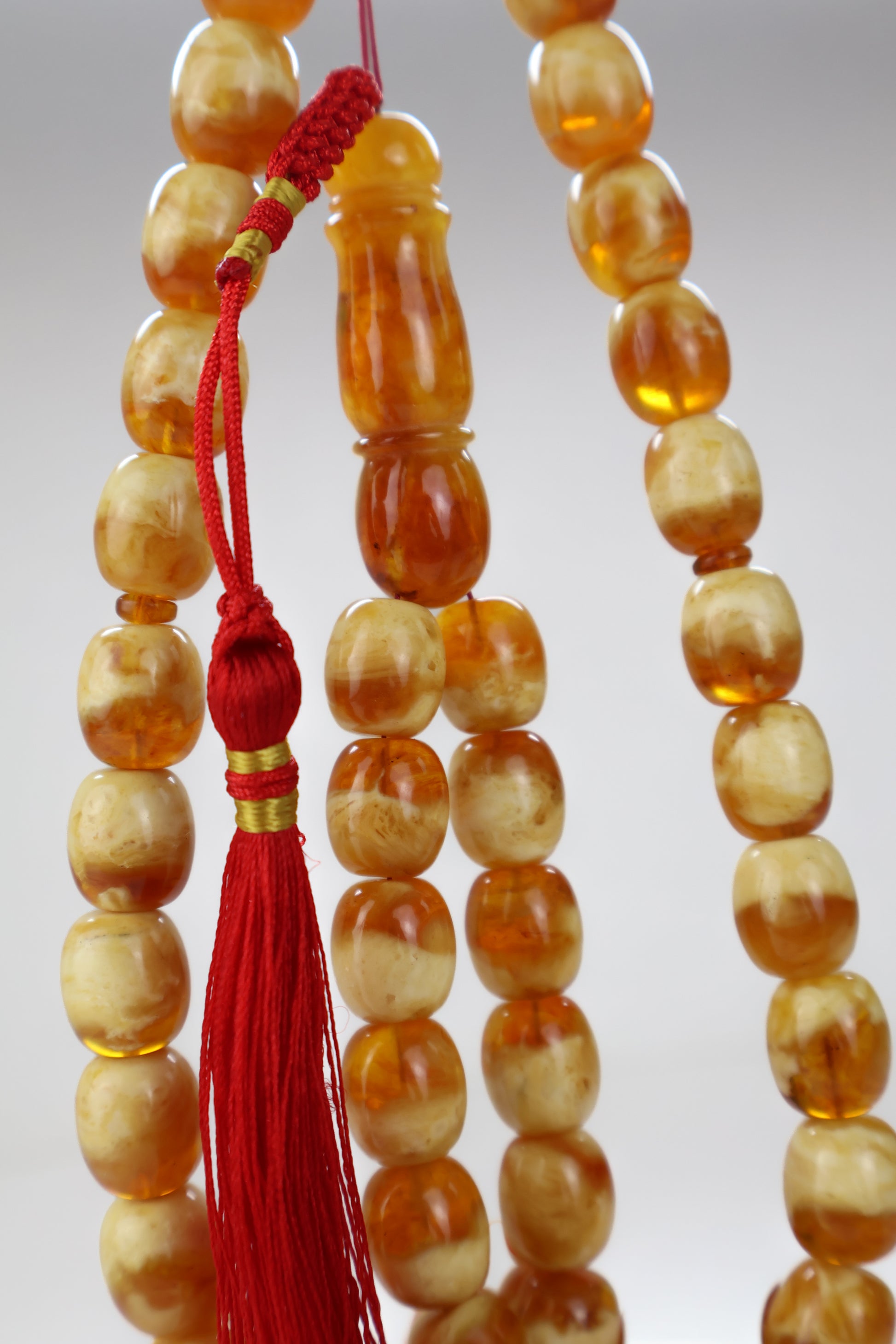 Pressed Baltic amber prayer beads 42 beads 13.5x12mm 63.63g with handmade red Qatari tassel and lab certificate from Tetibel Amber Jewels