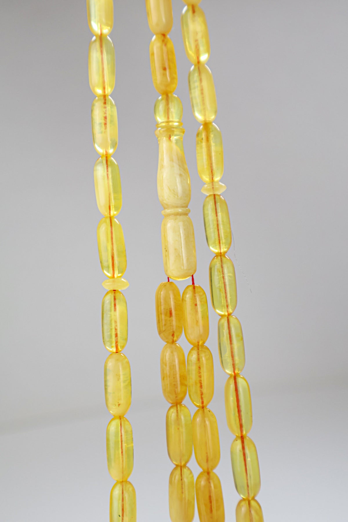 Certified translucent yellow Baltic amber misbaha rosary with 48 beads measuring 13.5x6 mm by Tetibel.
