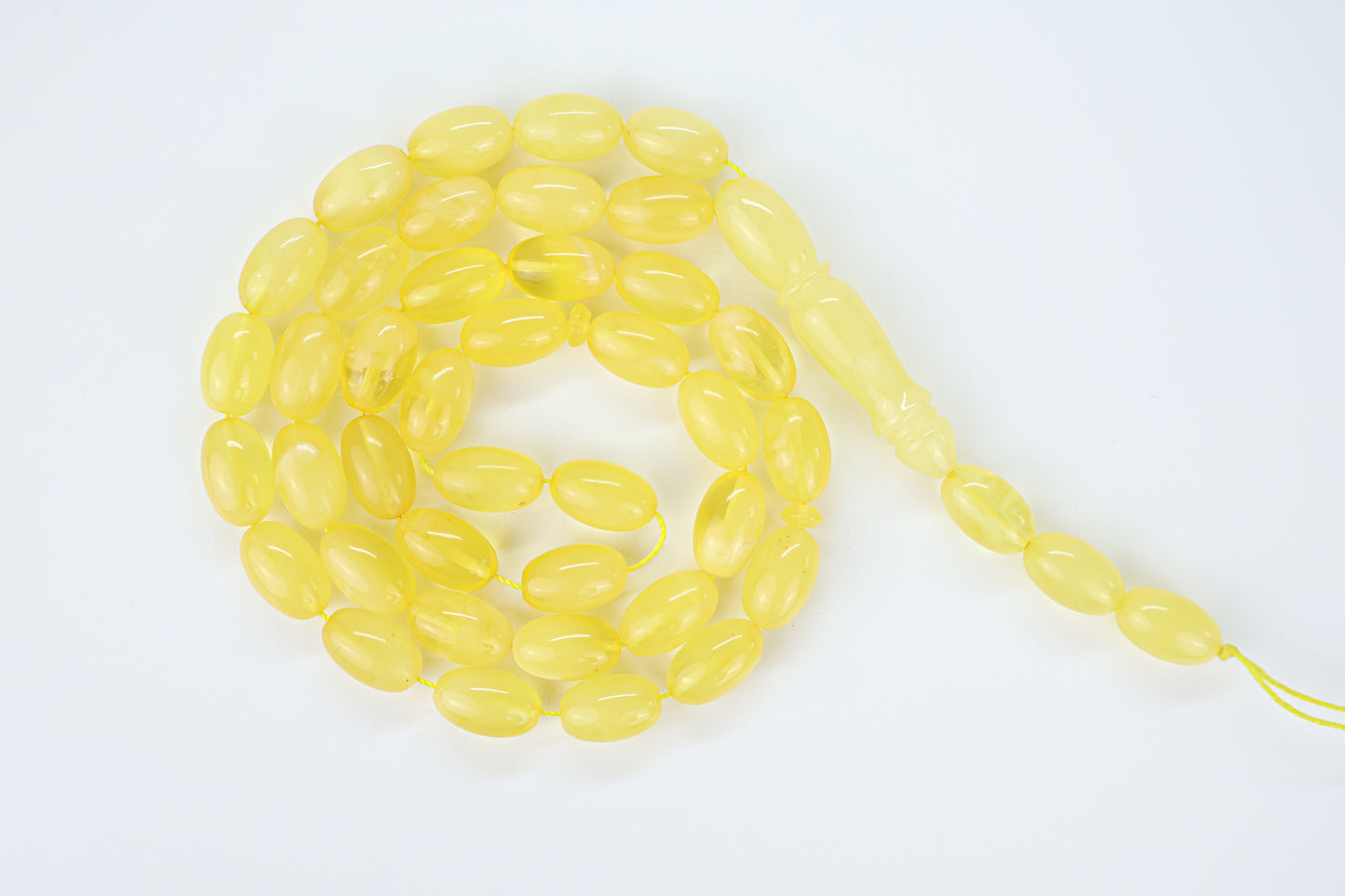 Handcrafted yellow succinite amber tasbih featuring 42 authentic beads, weight 33.02 grams.