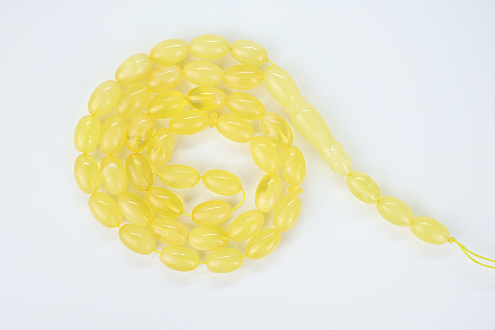 Handcrafted yellow succinite amber tasbih featuring 42 authentic beads, weight 33.02 grams.