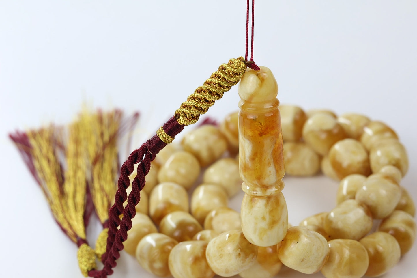 Authentic natural Baltic amber tasbih in cream and honey tones with 42 polished beads and imam centerpiece