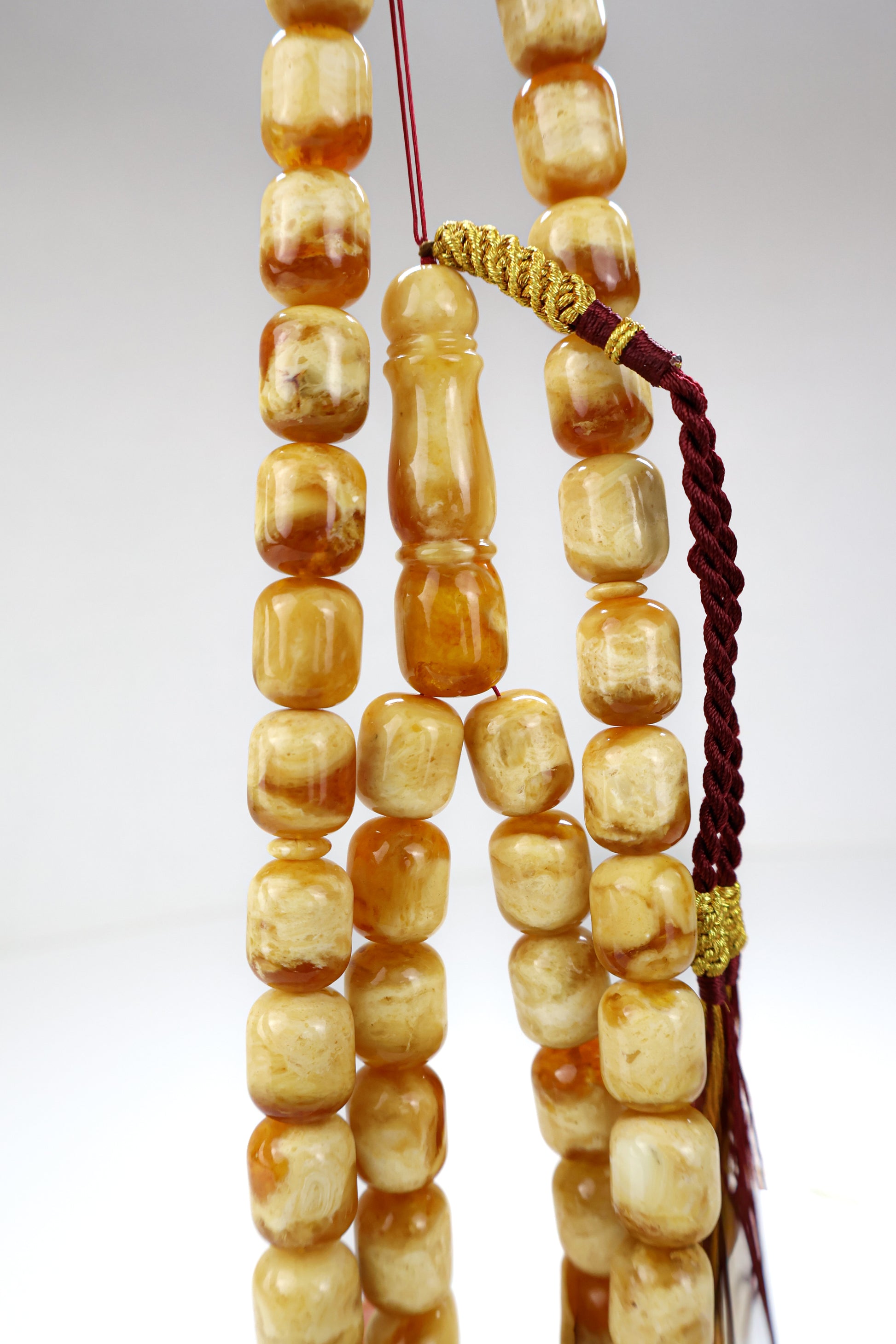 Pressed Baltic amber prayer beads 42 beads 15x12mm 72.25g with handmade burgundy and gold Doha Qatar tassel and lab certificate from Tetibel Amber Jewels