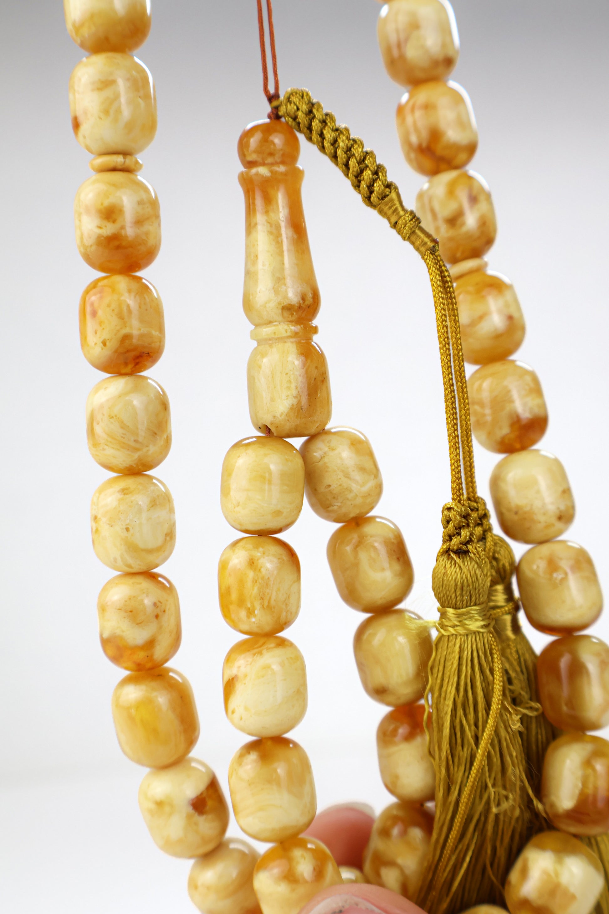 Pressed Baltic amber prayer beads 42 beads 13.7x11.8mm 60.38g with handmade Doha Qatar tassel and lab certificate from Tetibel Amber Jewels
