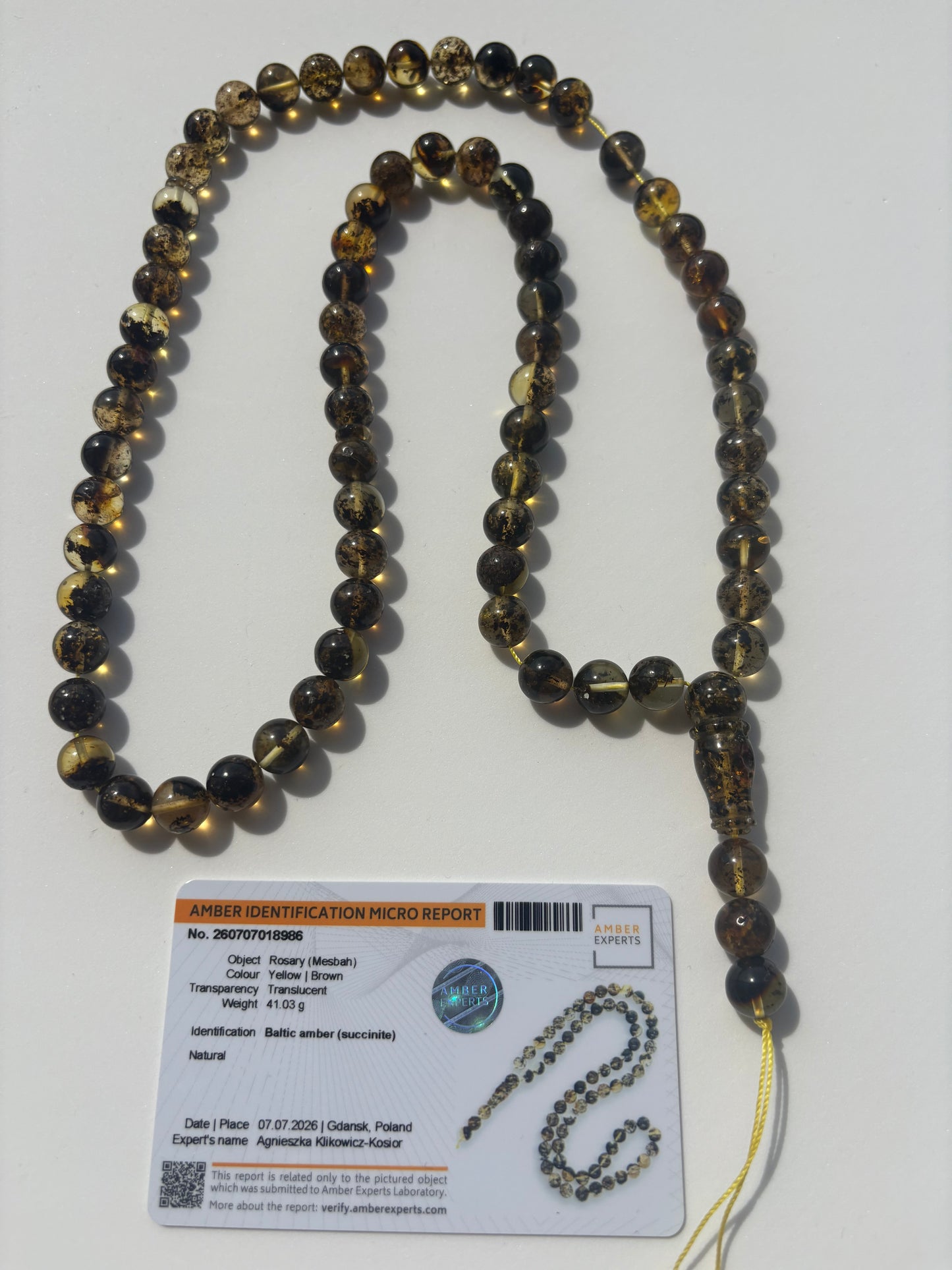 Natural Baltic amber Tesbih with 72 round beads featuring unique galaxy-like inclusions.
