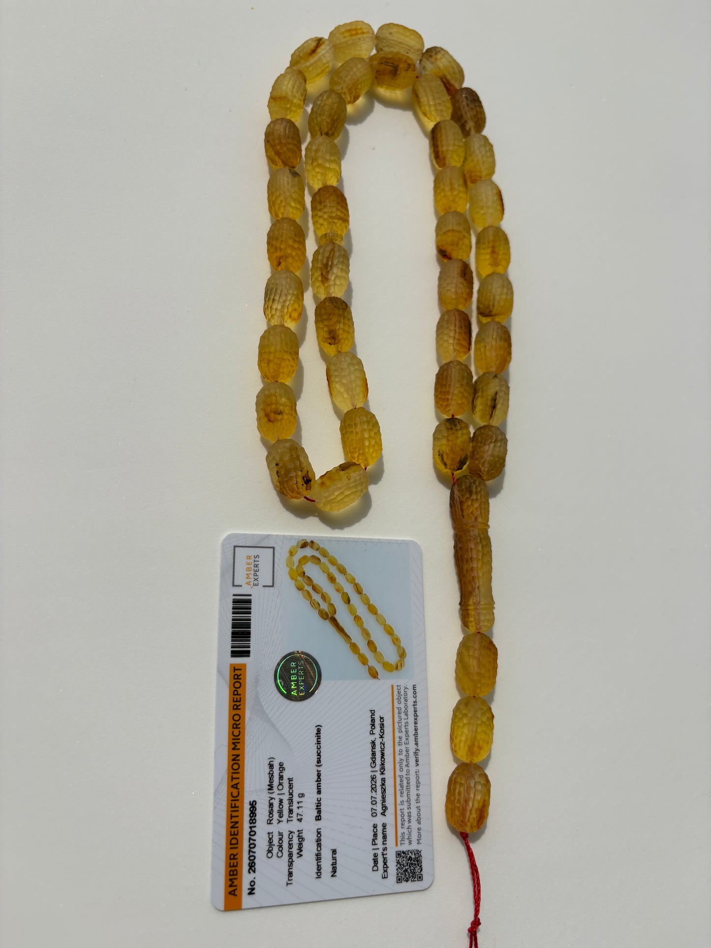Natural Baltic amber Misbaha featuring textured olive-shaped beads.