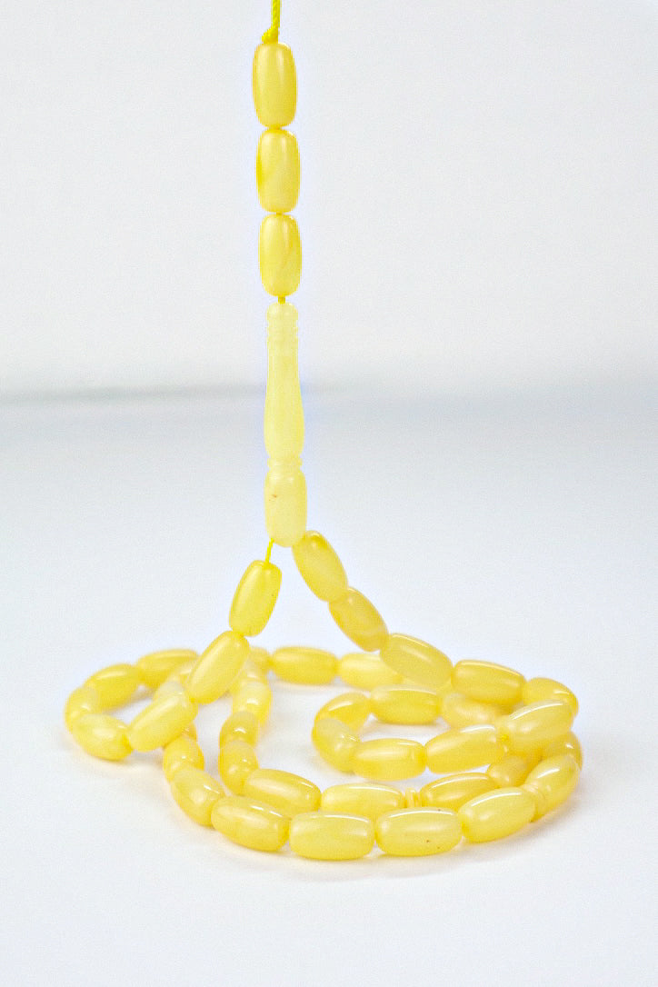 Certified natural opaque yellow Baltic amber misbaha rosary with 48 barrel beads measuring 12.4x6.3 mm by Tetibel.