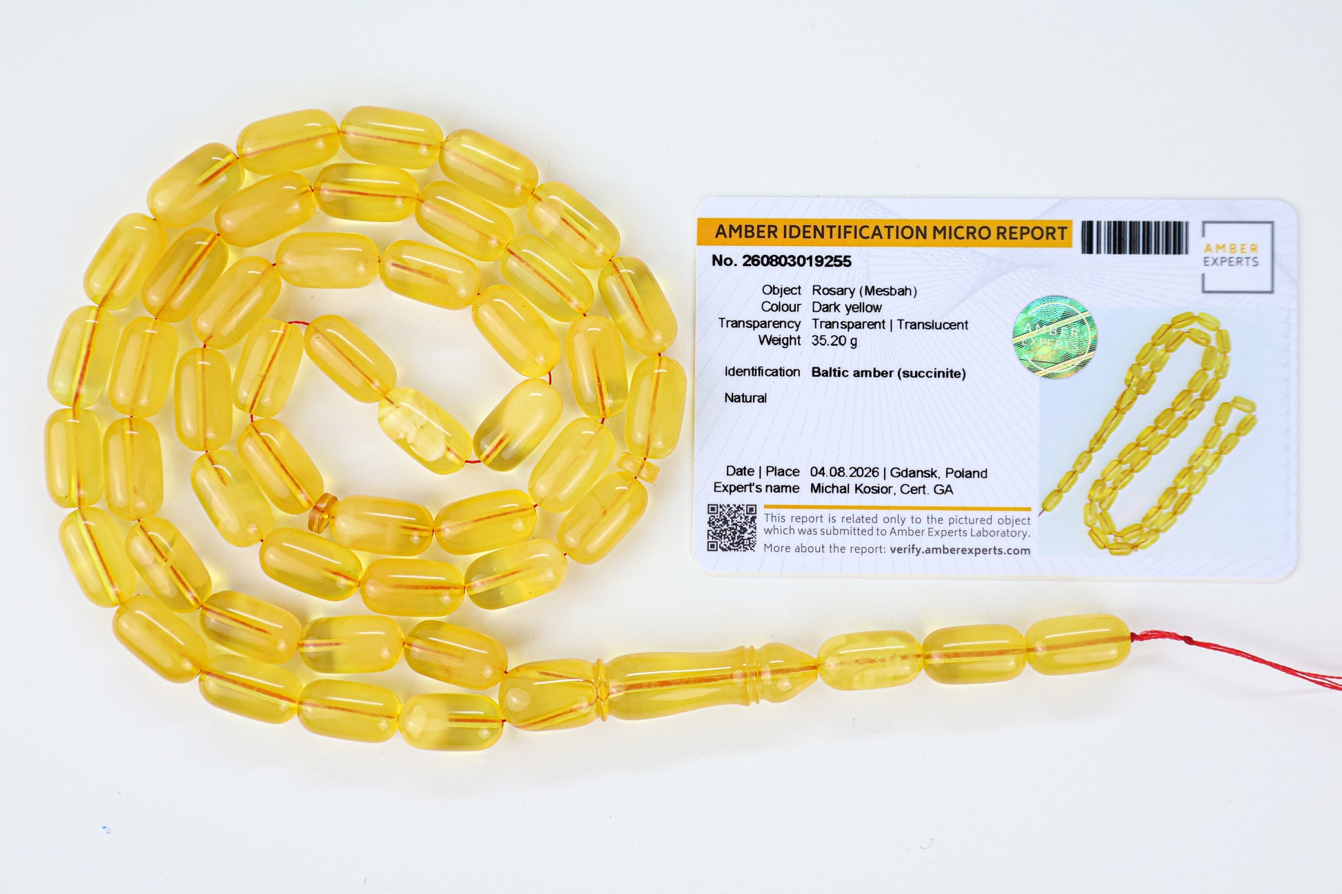 Laboratory certified natural Baltic amber rosary display with official micro report card from Tetibel Amber Jewels.