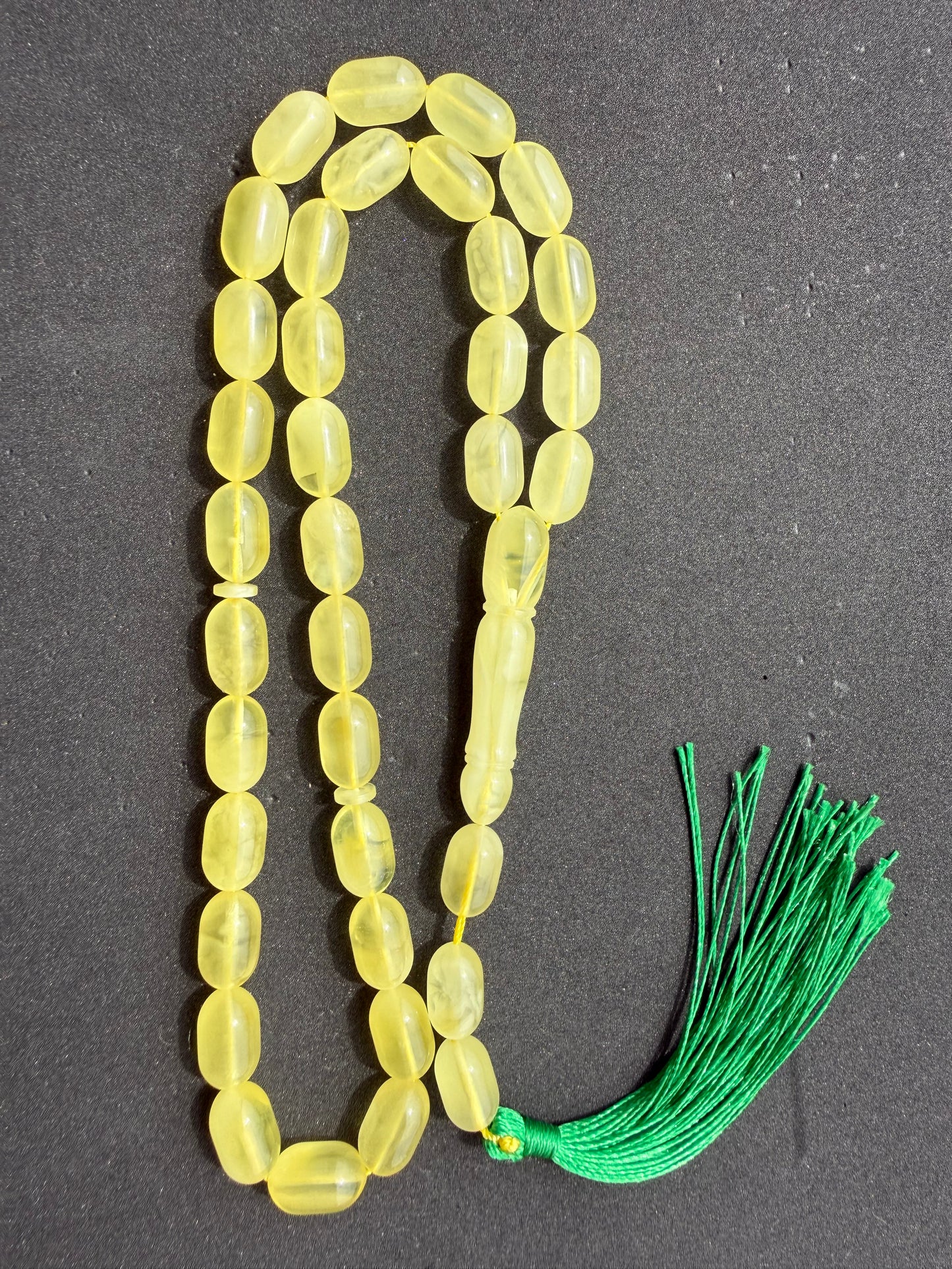 Genuine succinite amber prayer beads in soft lemon yellow color.