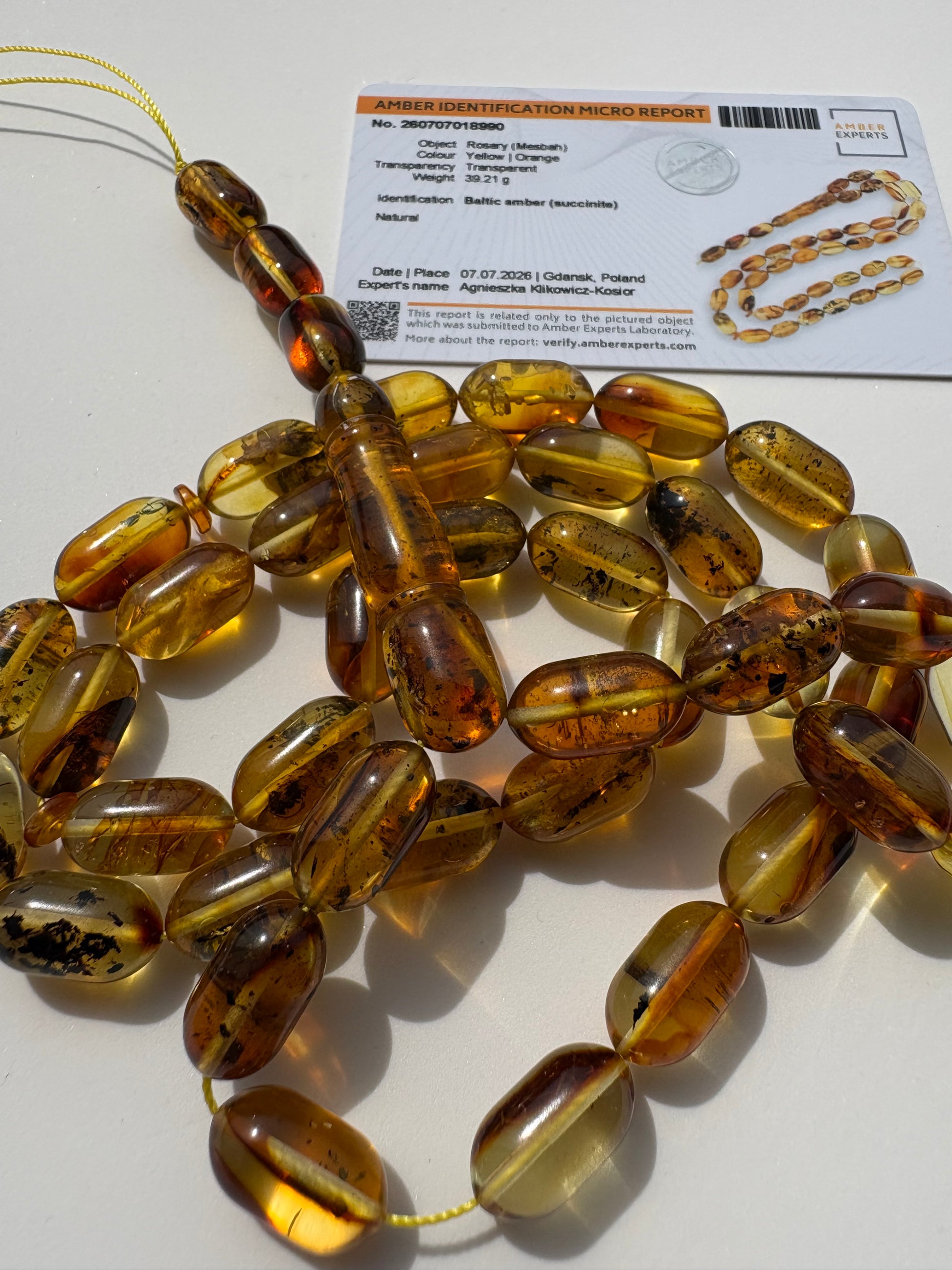 Natural Baltic amber Tesbih with 42 transparent olive-shaped honey amber beads.