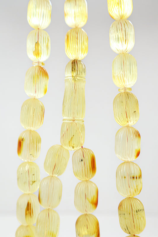 Certified natural hand-carved translucent yellow and brown Baltic amber misbaha rosary with 42 beads measuring 16x12 mm by Tetibel.