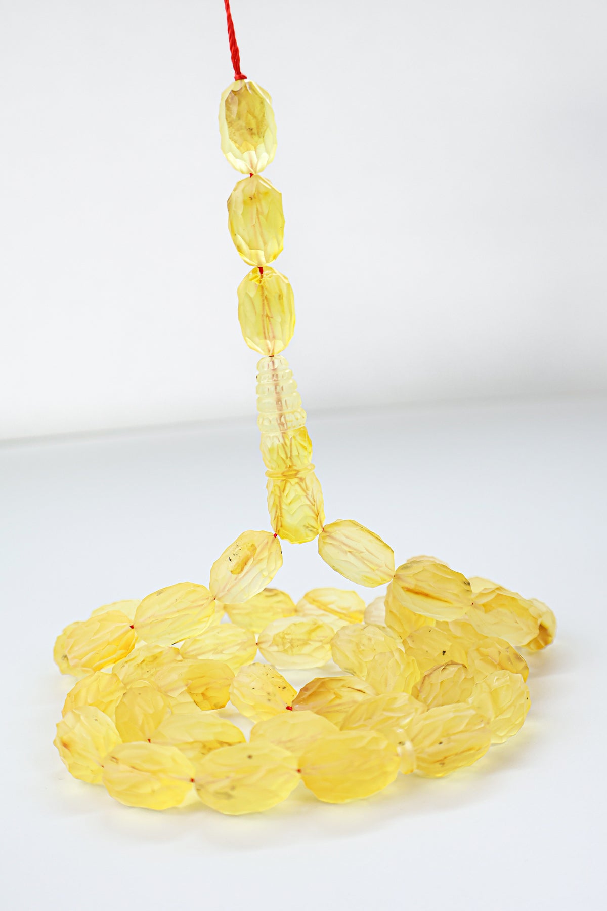 44.66g natural Baltic amber prayer beads (misbaha) with hand-cut faceted surfaces certified by Amber Experts Laboratory in Gdansk, Poland.