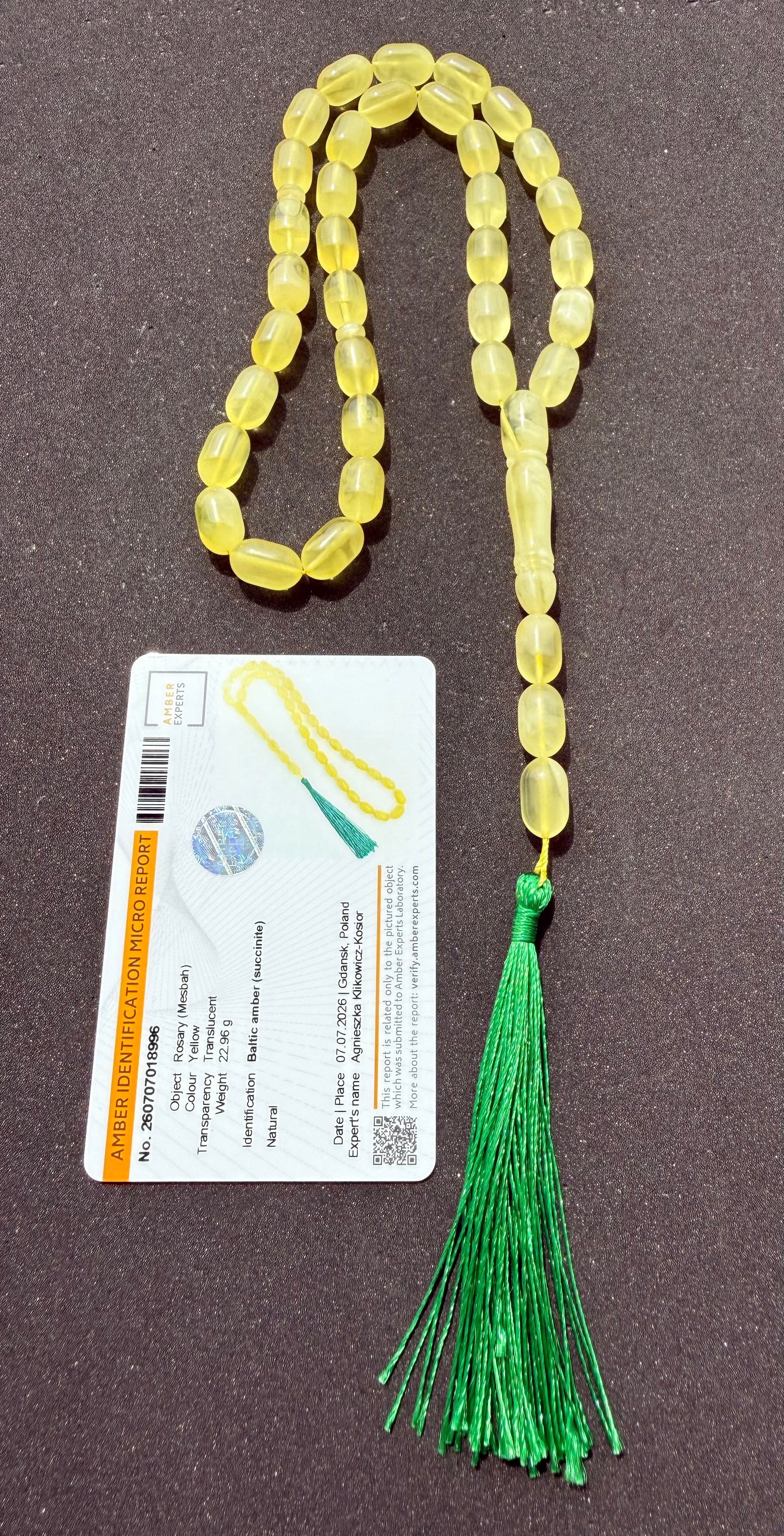 Luxury Baltic amber Tesbih with traditional olive-cut beads and green tassel.