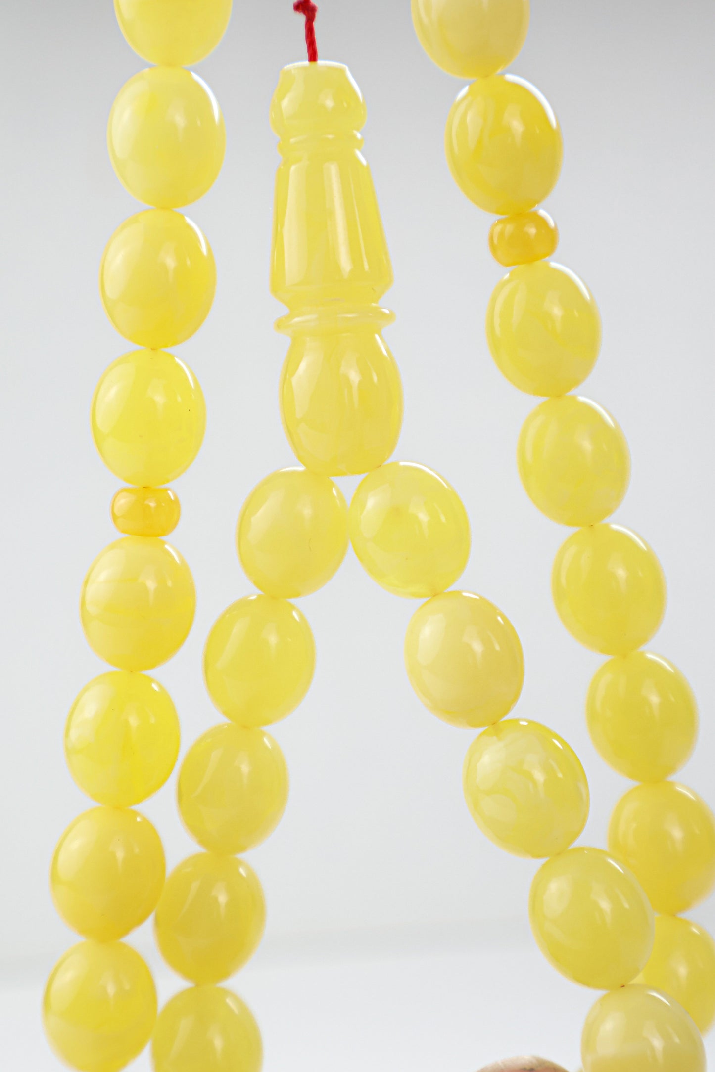Certified natural opaque yellow Baltic amber misbaha rosary with 45 beads measuring 13.8x11.7 mm by Tetibel.