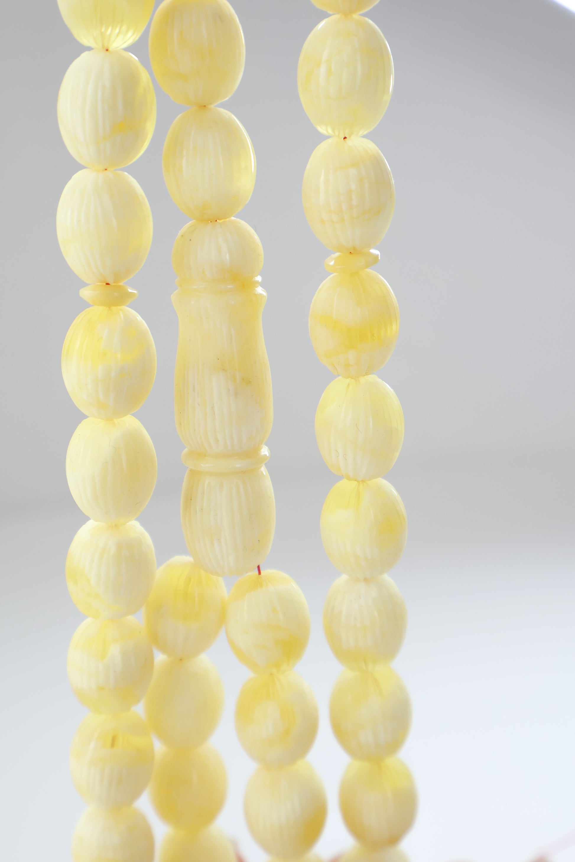 Pressed Baltic amber carved textured prayer beads 42 beads 15x12mm 56.12g with lab certificate from Tetibel Amber Jewels