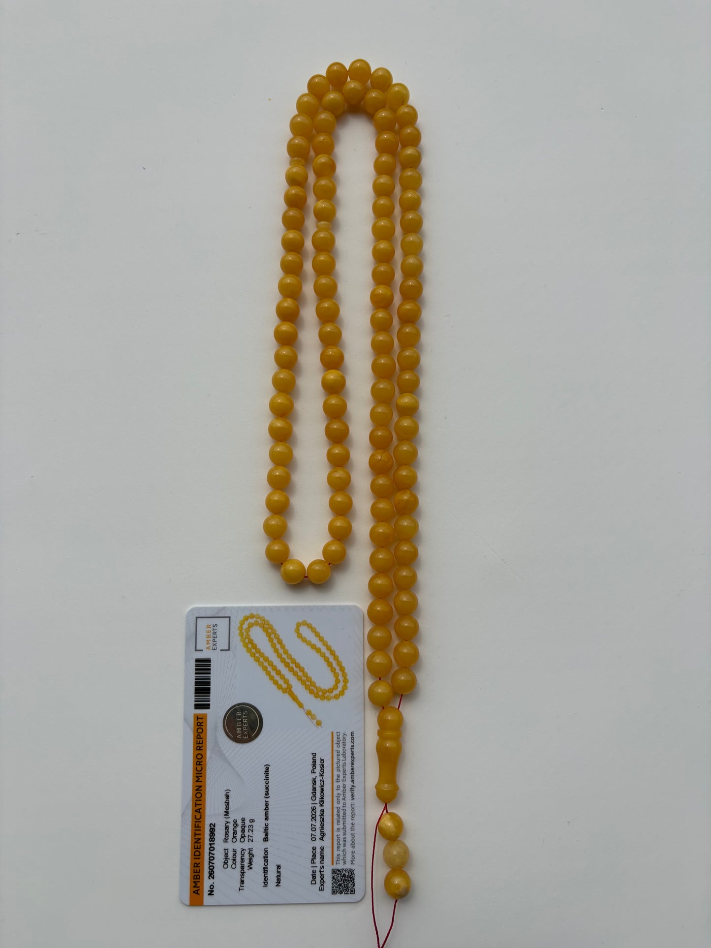 Certified natural Baltic amber Misbaha in intense mango yellow color.