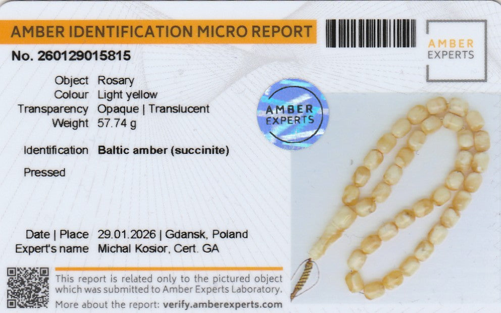 Amber identification micro report with a Rosary on a white background