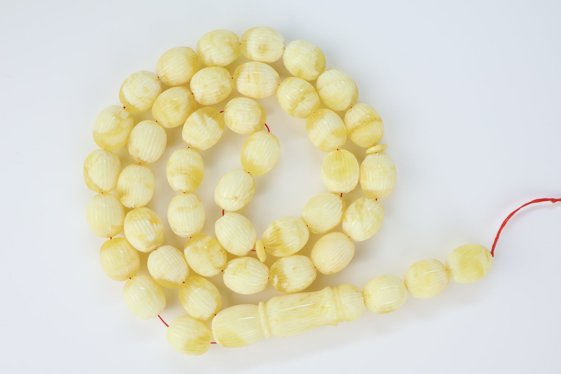 Pressed Baltic amber carved textured prayer beads 42 beads 15x12mm 56.12g with lab certificate from Tetibel Amber Jewels