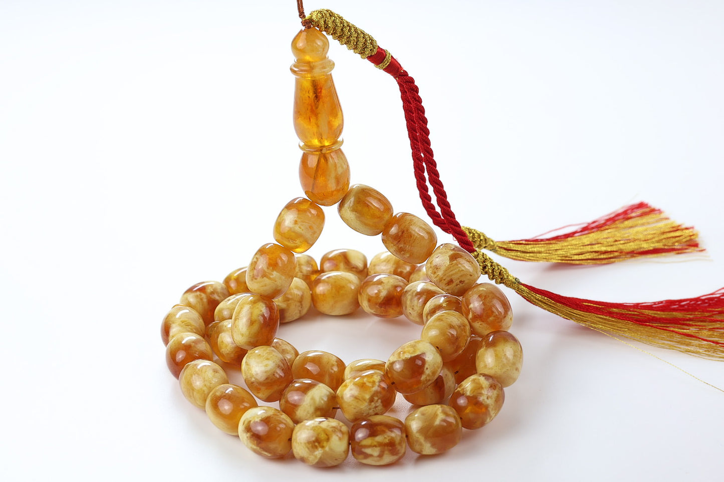 Pressed Baltic amber rosary 33 beads in honey marbled color, certified succinite amber misbaha with red and gold tassel