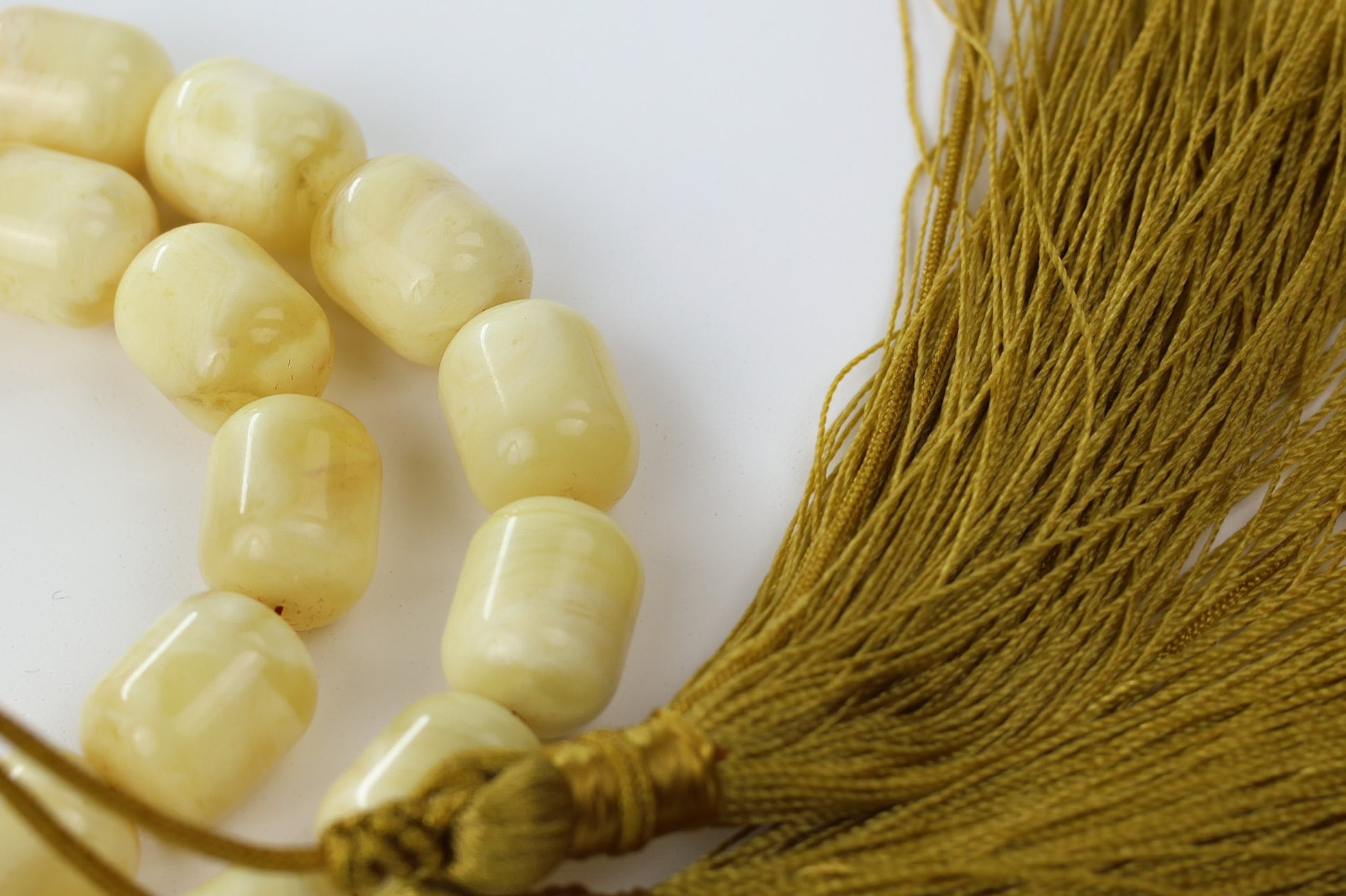 Pressed amber rosary in light yellow milky color with gold tassel and barrel imame, 36 prayer beads and tassel