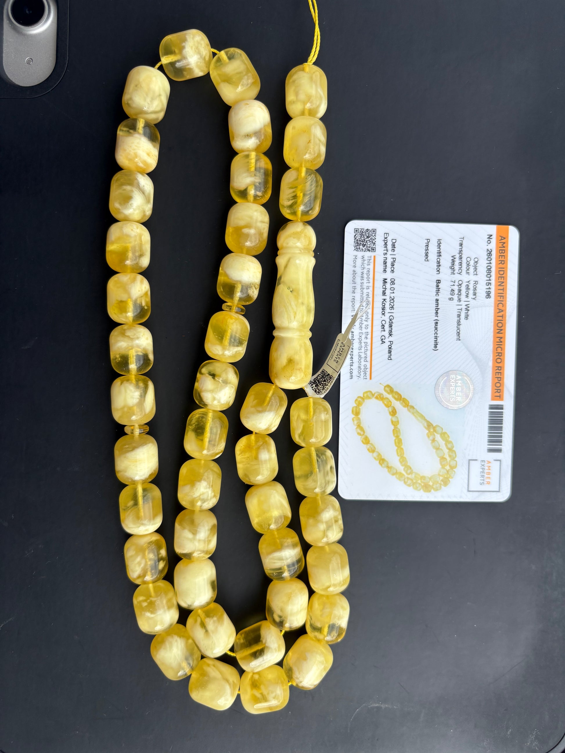 Tetibel 42-bead pressed Baltic amber rosary with 14.5x12.5mm yellow and white marbled barrel beads and an official authenticity certificate.