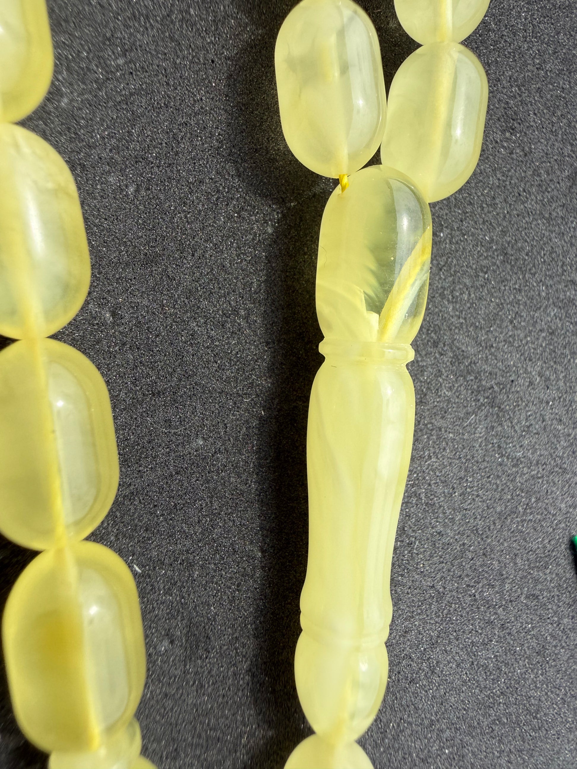 Certified Baltic amber Misbaha featuring polished 13 x 8 mm olive beads.