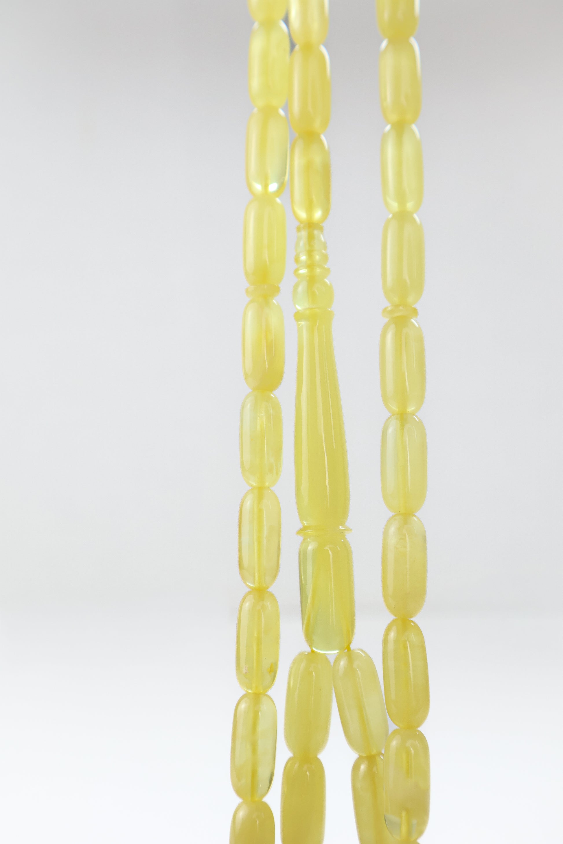 Authentic translucent yellow Baltic amber misbaha strand with elongated imam head and 42 beads.