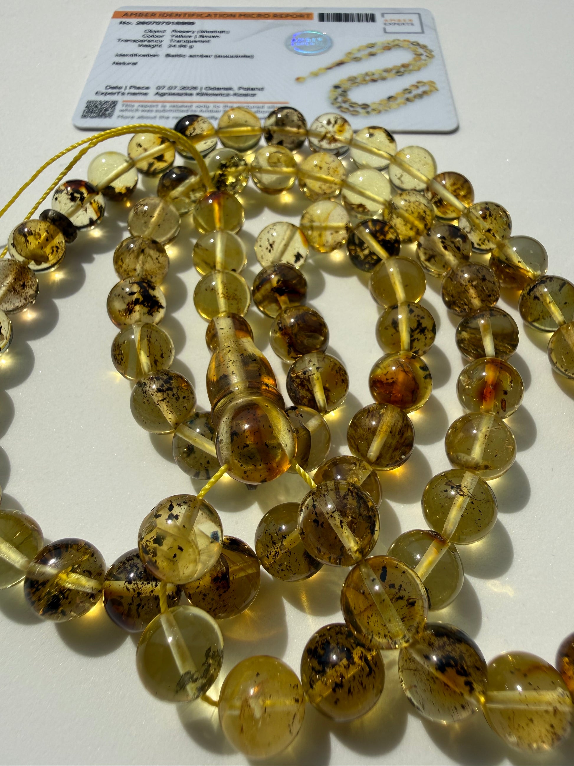 Authentic honey cognac amber rosary with certificate of authenticity.