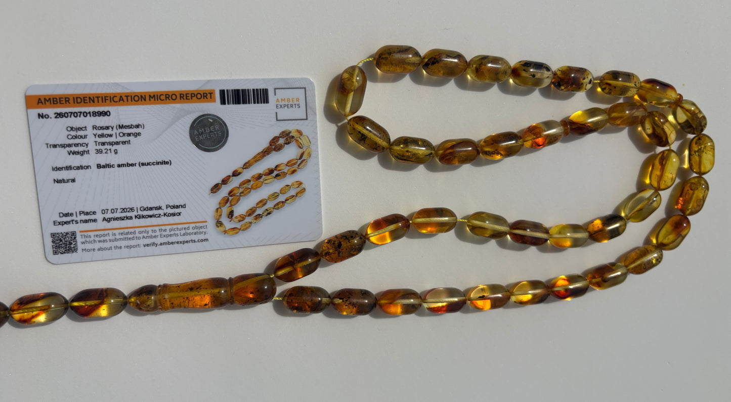 Certified Baltic amber Misbaha featuring cognac and honey olive beads.